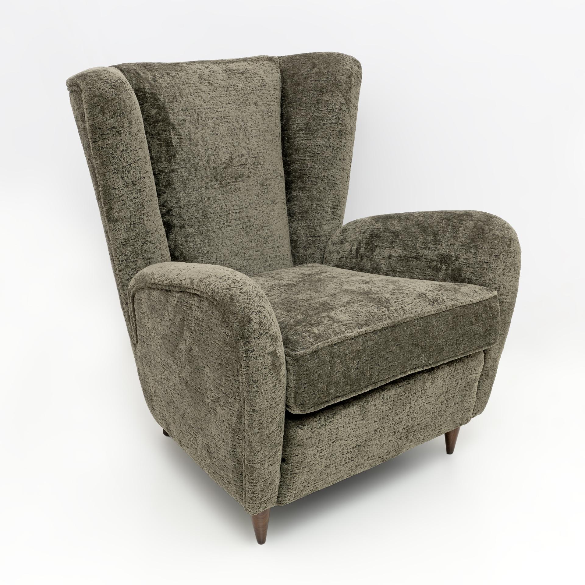 Beautiful armchair with curved armrests, made by Paolo Buffa in 1950. The curved and padded wooden structure, the covering has been replaced with a beautiful very dark green Bouclè fabric, as shown in the photo. Ready to furnish your home