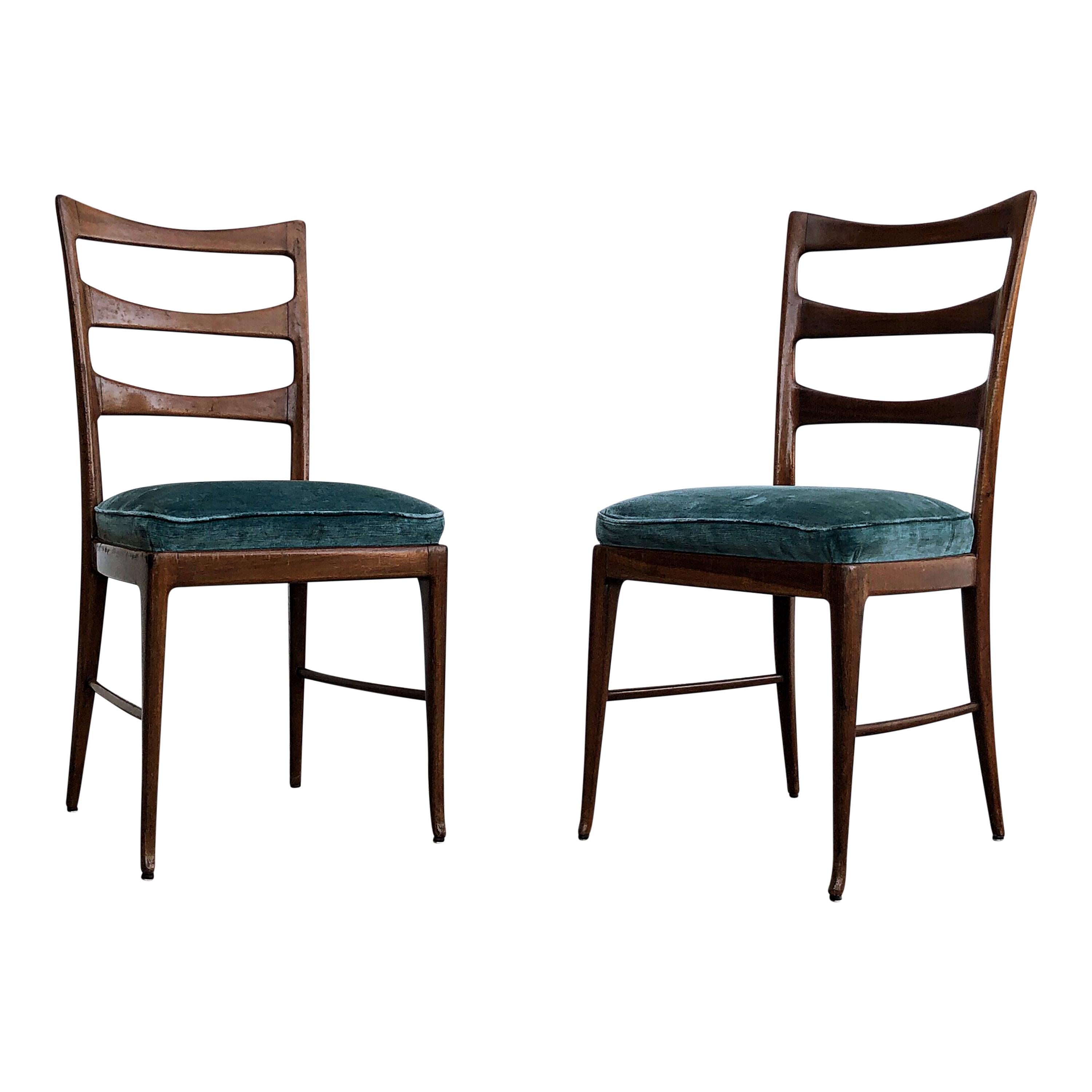 Sculptural handcrafted dining chairs by Paolo Buffa, Italy, 1948. 
The beautifully carved high back chairs have a sophisticated sculptural quality. 
The back composed of three lozenge shaped cross braces joined to the curved and pointed uprights,