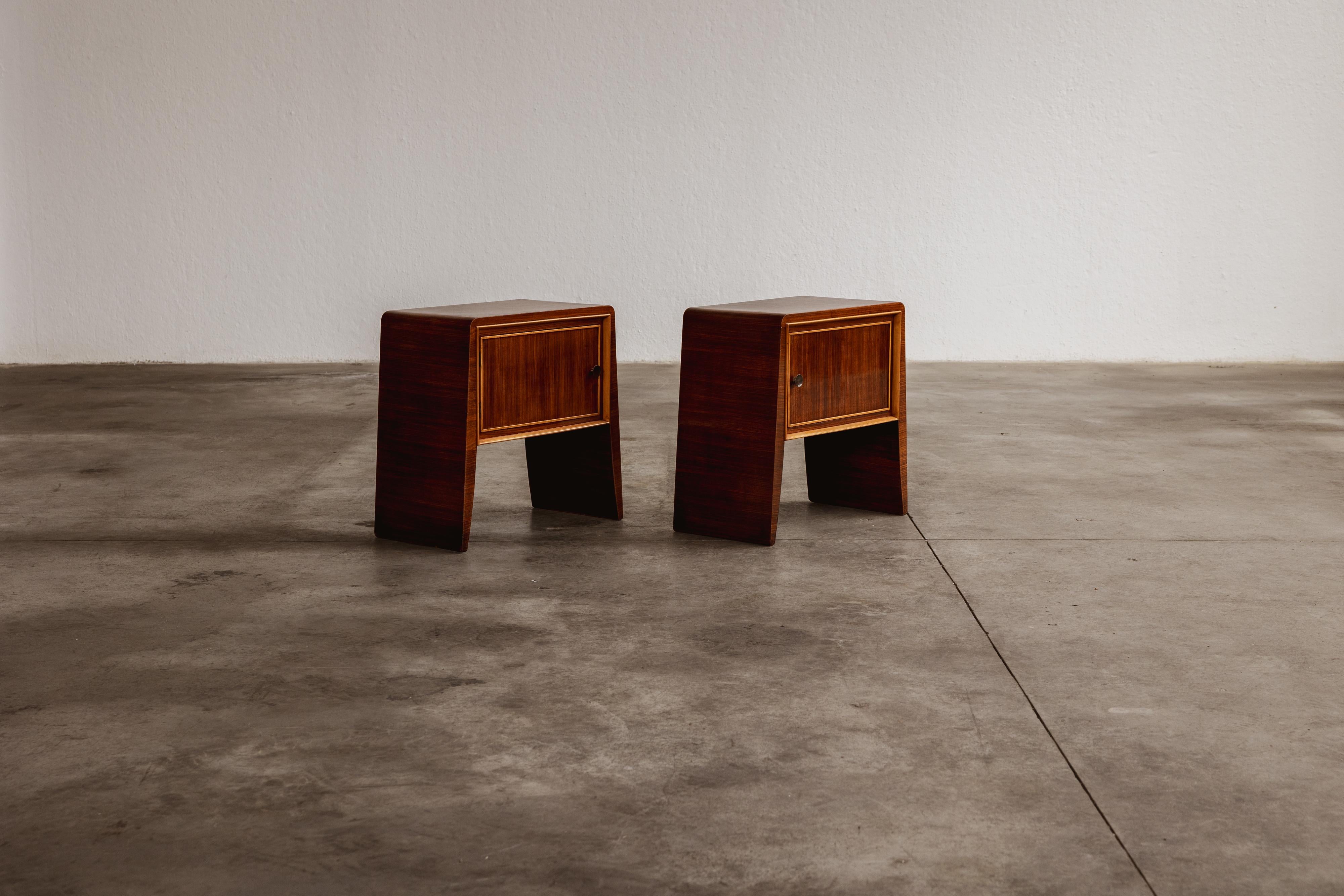 Paolo Buffa nightstands for La Permanente Mobili Cantù, mahogany, Italy, 1950s, set of two.

The Paolo Buffa nightstands, crafted in the 1950s, embody an exquisite blend of function and form, marking a pinnacle of mid-century modern design. These