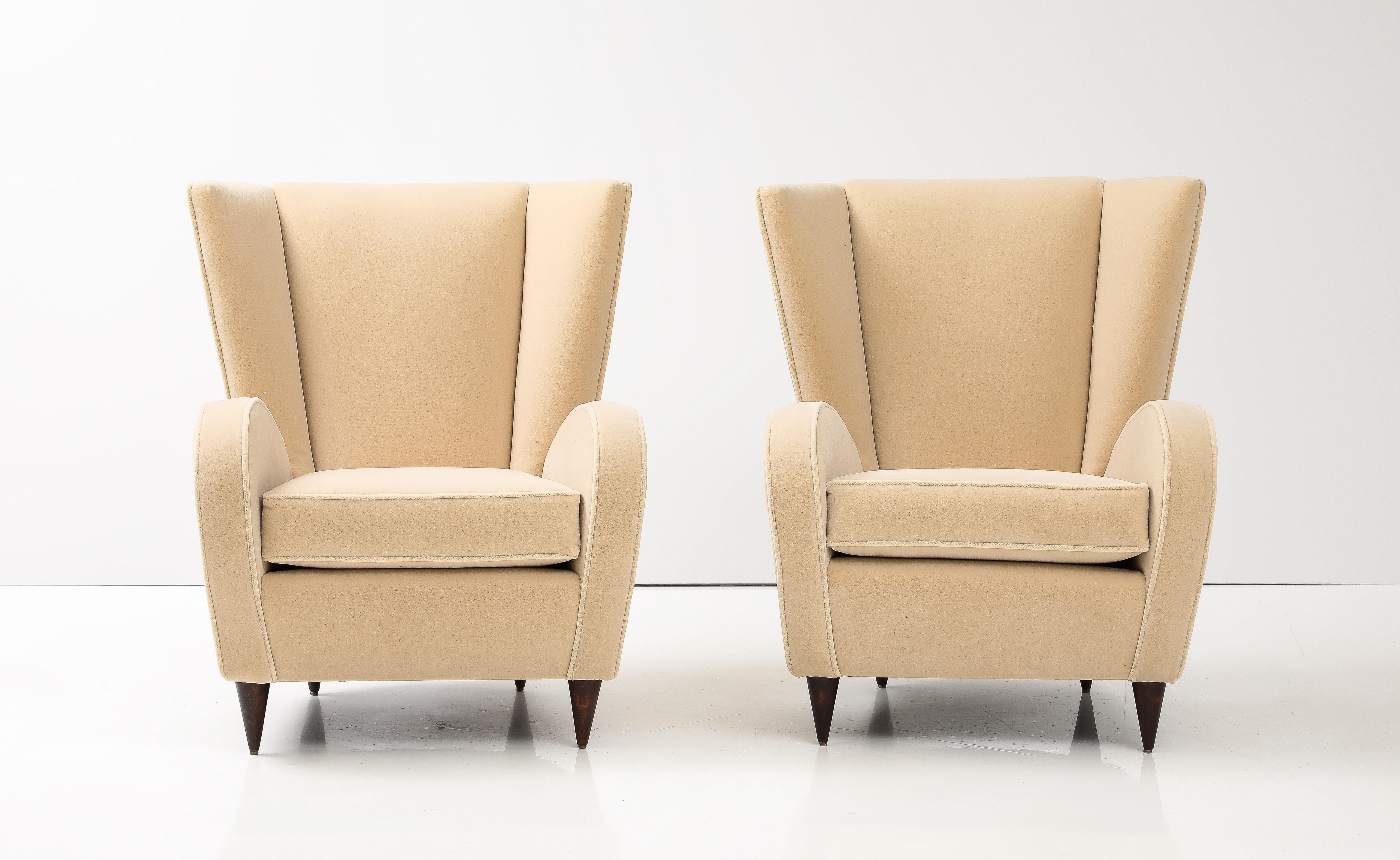  A pair of Paolo Buffa lounge chairs, designed in 1950 for the Hotel Bristol, Merano, an Italian resort. The chairs are indicative of Buffa's signature style, modernist and sleek but with a nod toward the elegant and refined lines of the Neoclassic