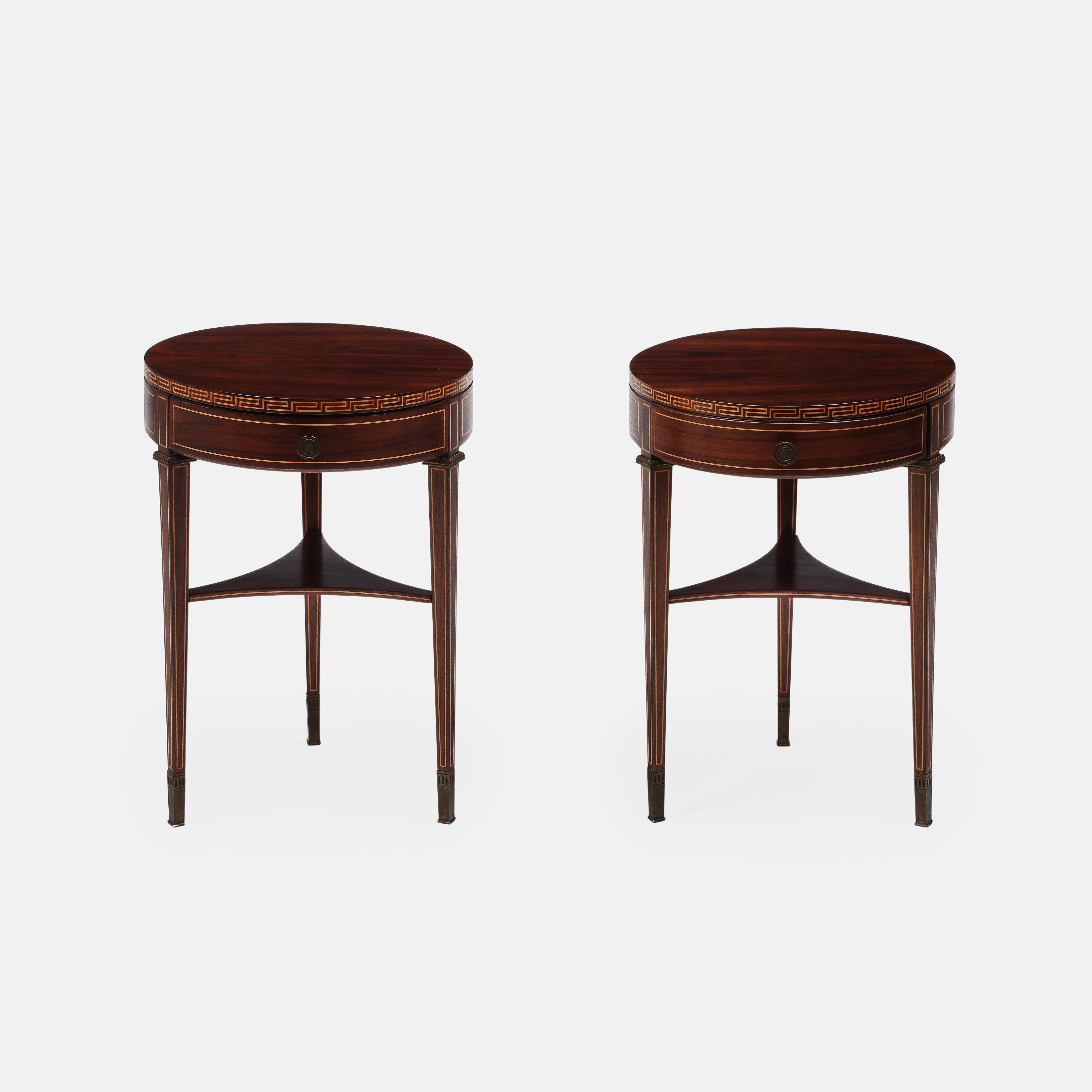 Paolo Buffa elegant rare pair of tripod bedside tables or nightstands in rosewood with maple inlays with decorative bronze mounts and single drawer with brass drawer pulls, and ending in bronze sabots, Italy, 1940s. These exquisite tables are in the