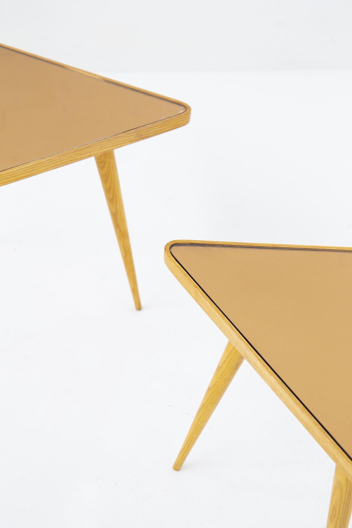 Very rare pair of triangular coffee tables designed by the great Paolo Buffa for Serafino Arrighi production, with surveyed drawing attesting to the authenticity of the piece. The small tables are very beautiful and distinctive, made entirely of a