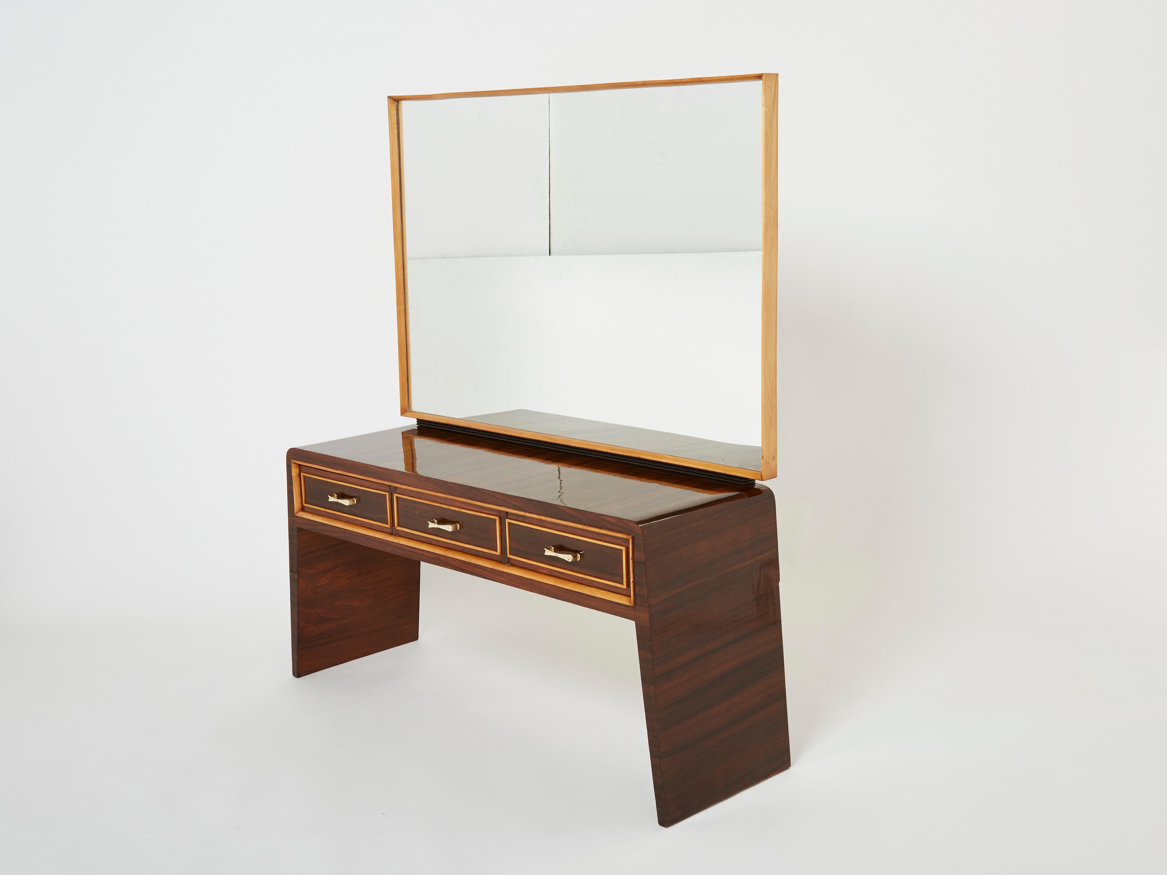 This rare and beautiful vanity designed by Paolo Buffa in Italy in the 1940s imparts a cosy, chic and glowing mood to a space. The warm rosewood remains looking beautiful and smooth eighty plus years later. Elegantly shaped, seating on two curved