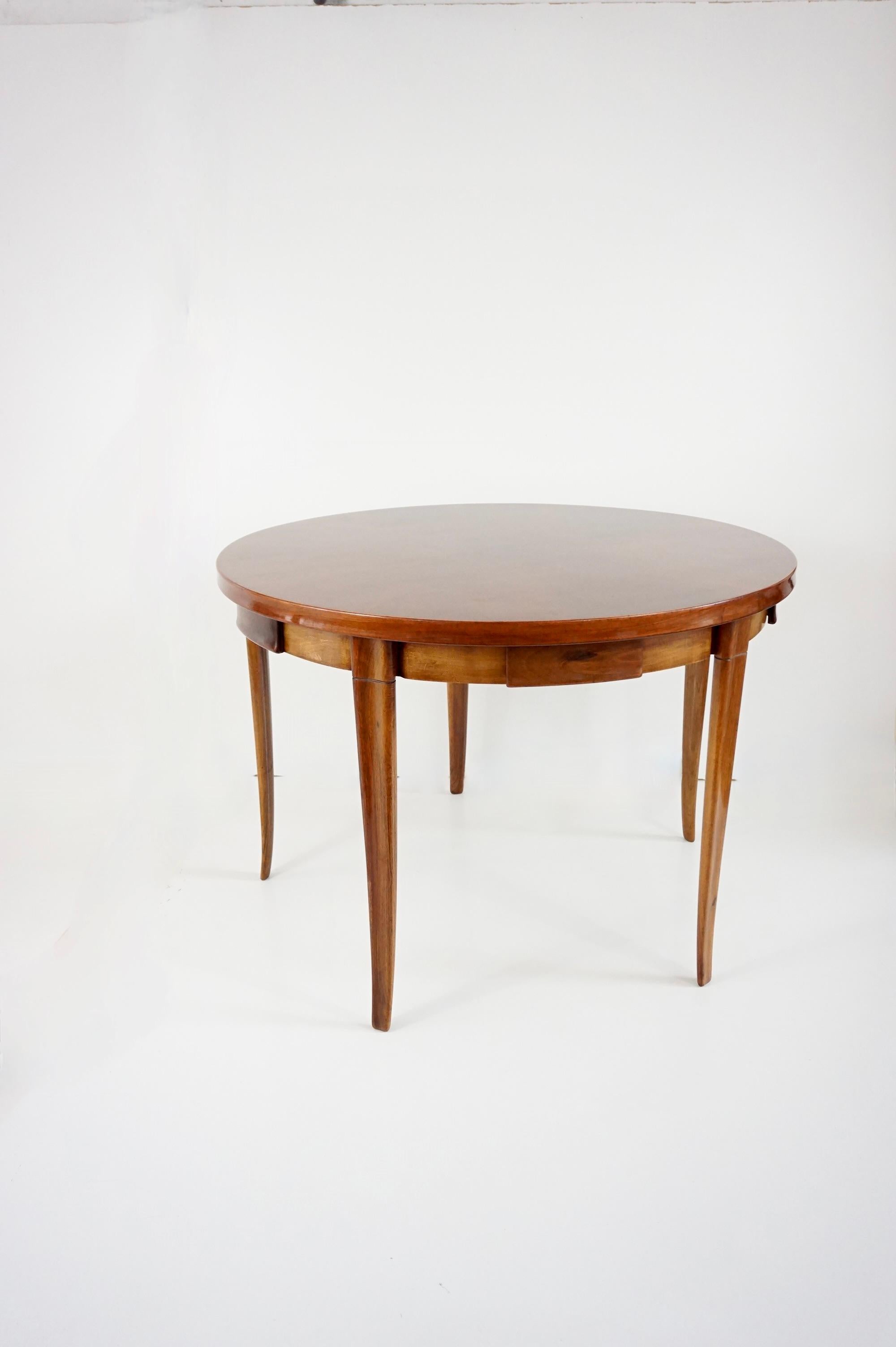elegant and fine game  table by Arch. Paolo Buffa, circa 1950 
also available as a center table
five sculptural and carver legs, five hidden drawers, inlayed patterned top
very good original condition and very good patina 
measures: dia: 108,