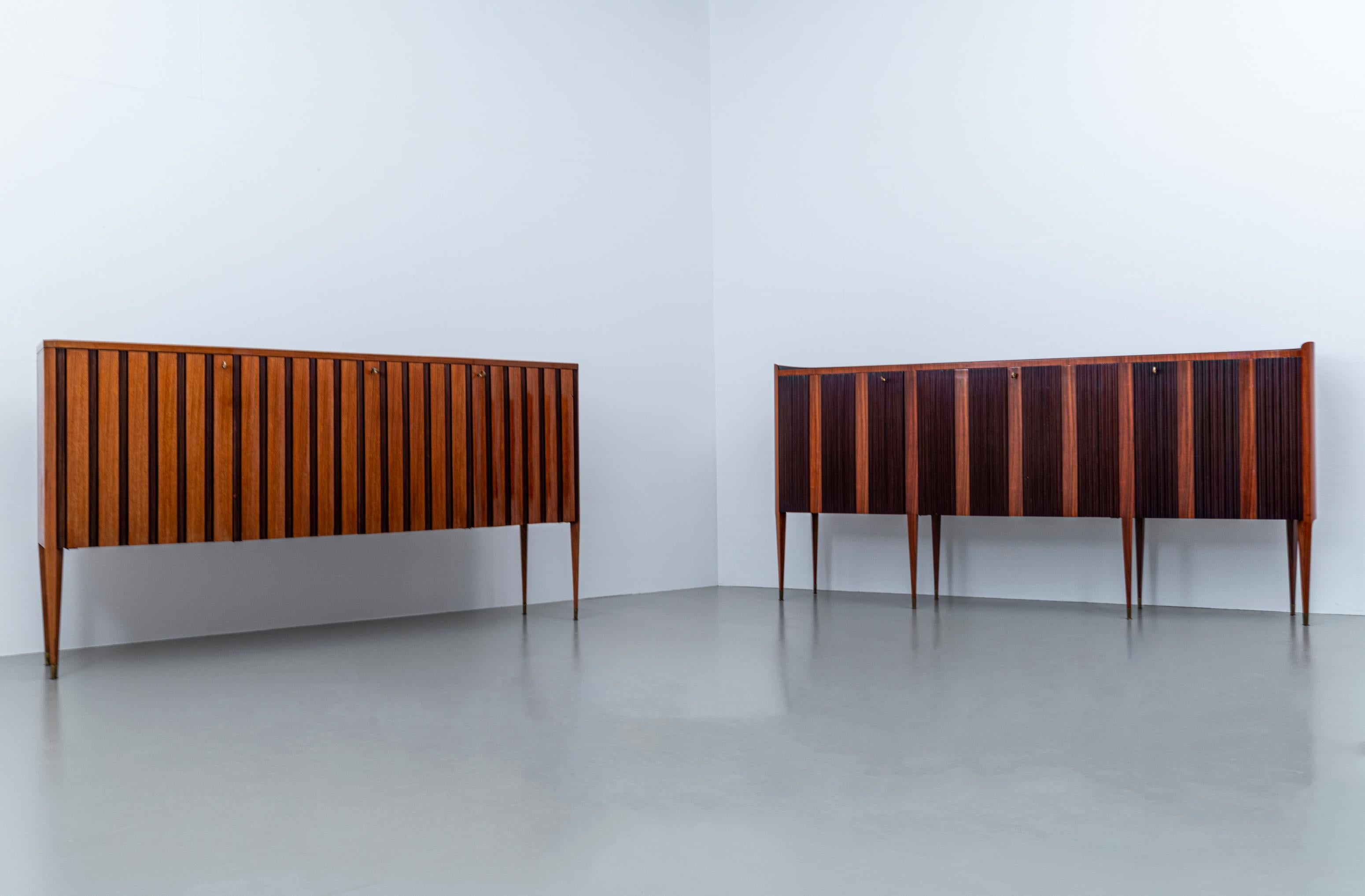 Exceptional pair of high credenza's by Paolo Buffa in very good condition. What notices most is the size and the quality of these magnificent works of art. They are high and mighty and it must have costed them ages to make these. People who work