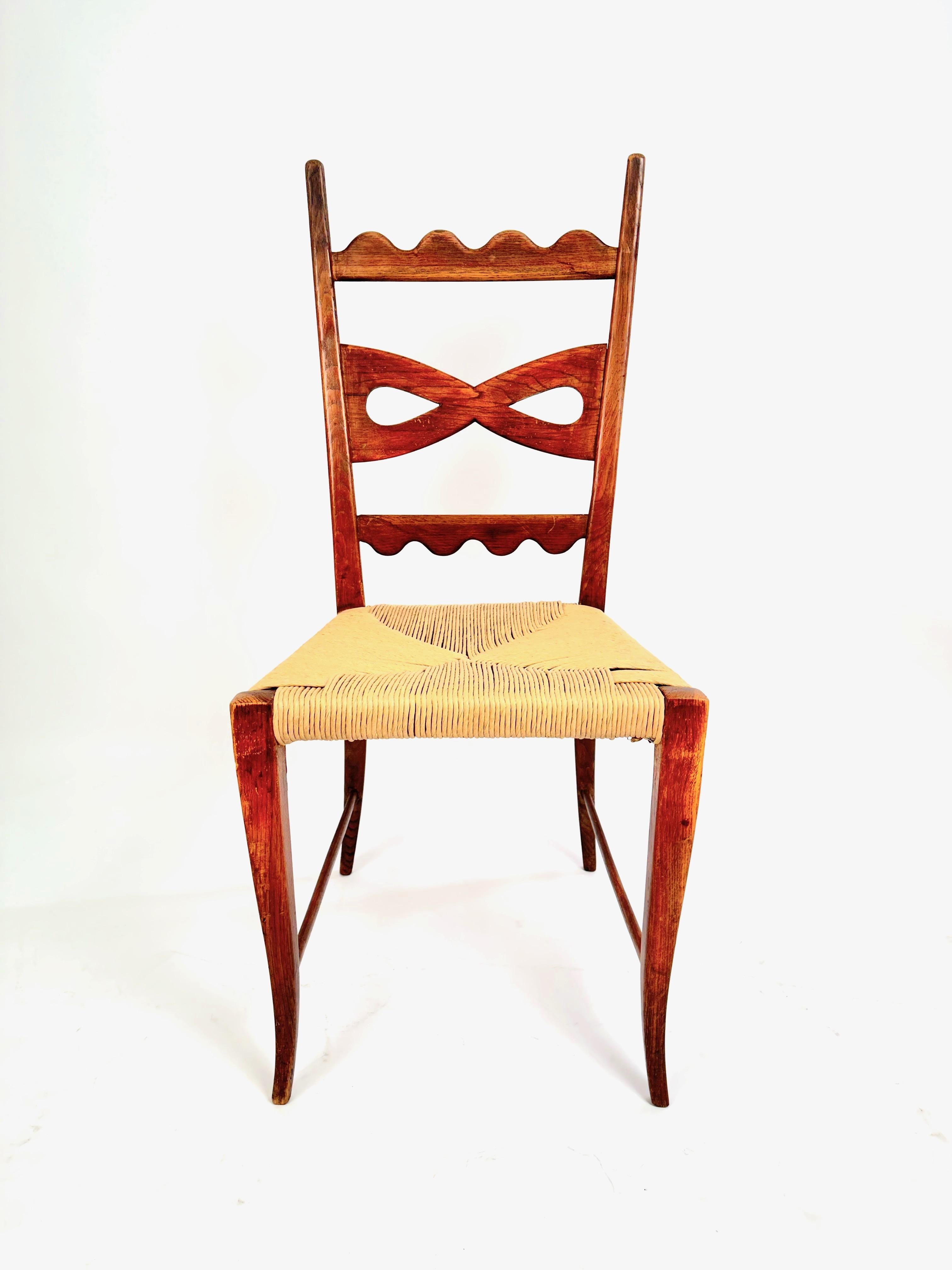 A rare set of six dining chairs, designed by Paolo Buffain the 1940s. Typical details for Buffa craftsmanship, including the decorative bow shaped and scalloped patterns on the back rests the carved ring pattern on the front legs and the carved