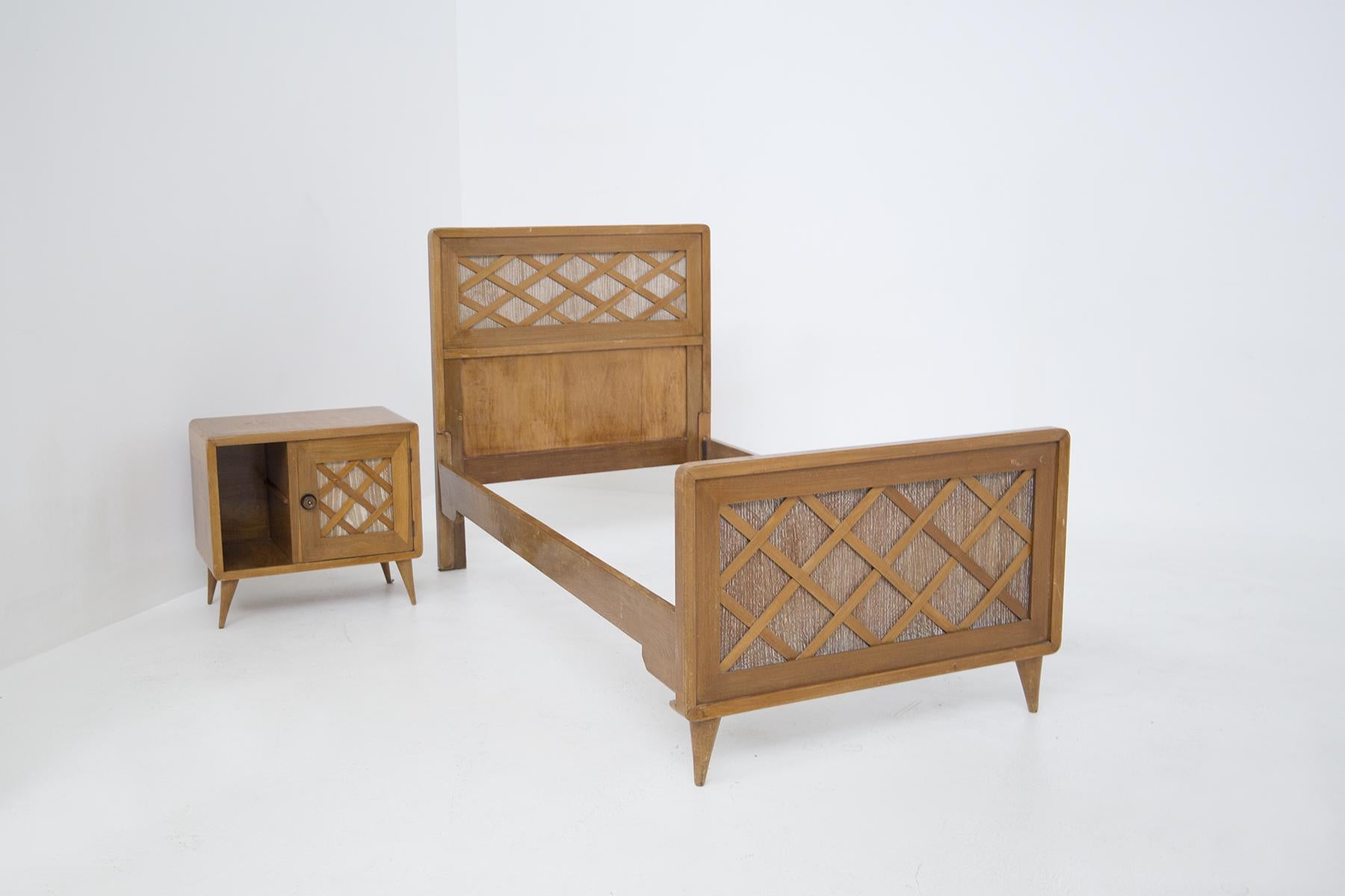 This wooden single bed and bedside table are designed by Paolo Buffa in the 1950s and they are of fine Italian workmanship. The bed has a classic rectangular shape, totally made of wood. There are 4 feet, but the feet under the headboard are