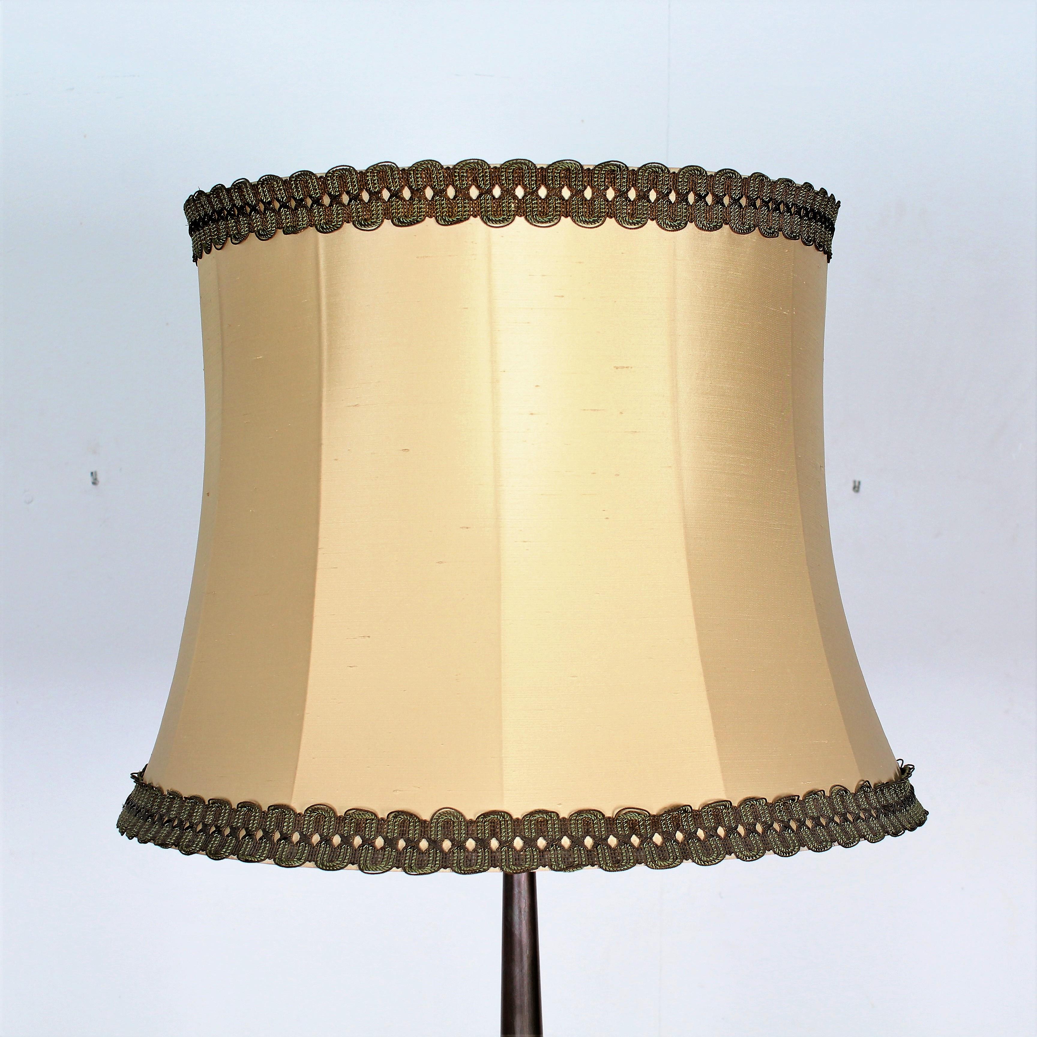 Elegant brass column floor lamp on a tripod base with spherical crystal element in the center and double pull switch , original lampshade .
Very elegant and high quality object.
In the style of Paolo Buffa Italy  1950s.
Wear consistent with age and