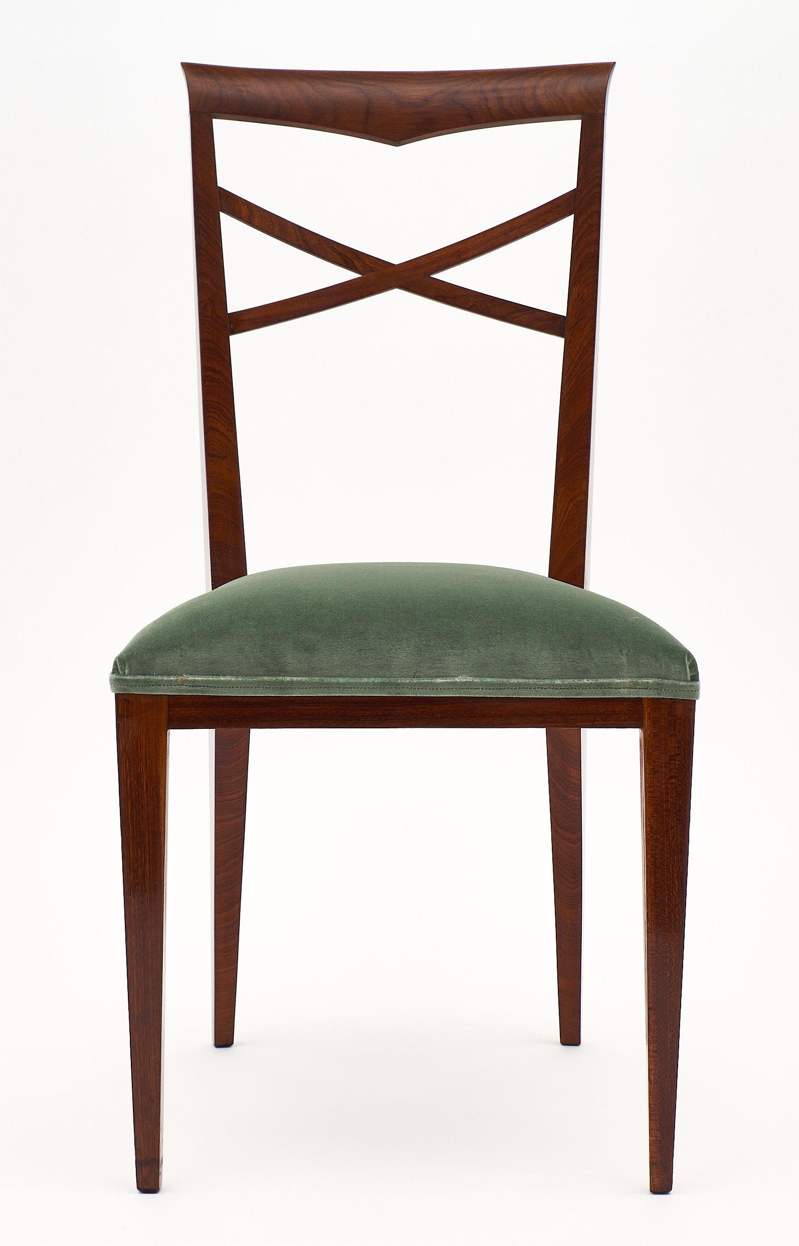 An elegant and refined set of Italian Paolo Buffa style dinning chairs mad of solid walnut finished with a French polish. We love the clean design reminiscent of Buffa, and the strength and comfort of the chairs. The design brings lightness to a