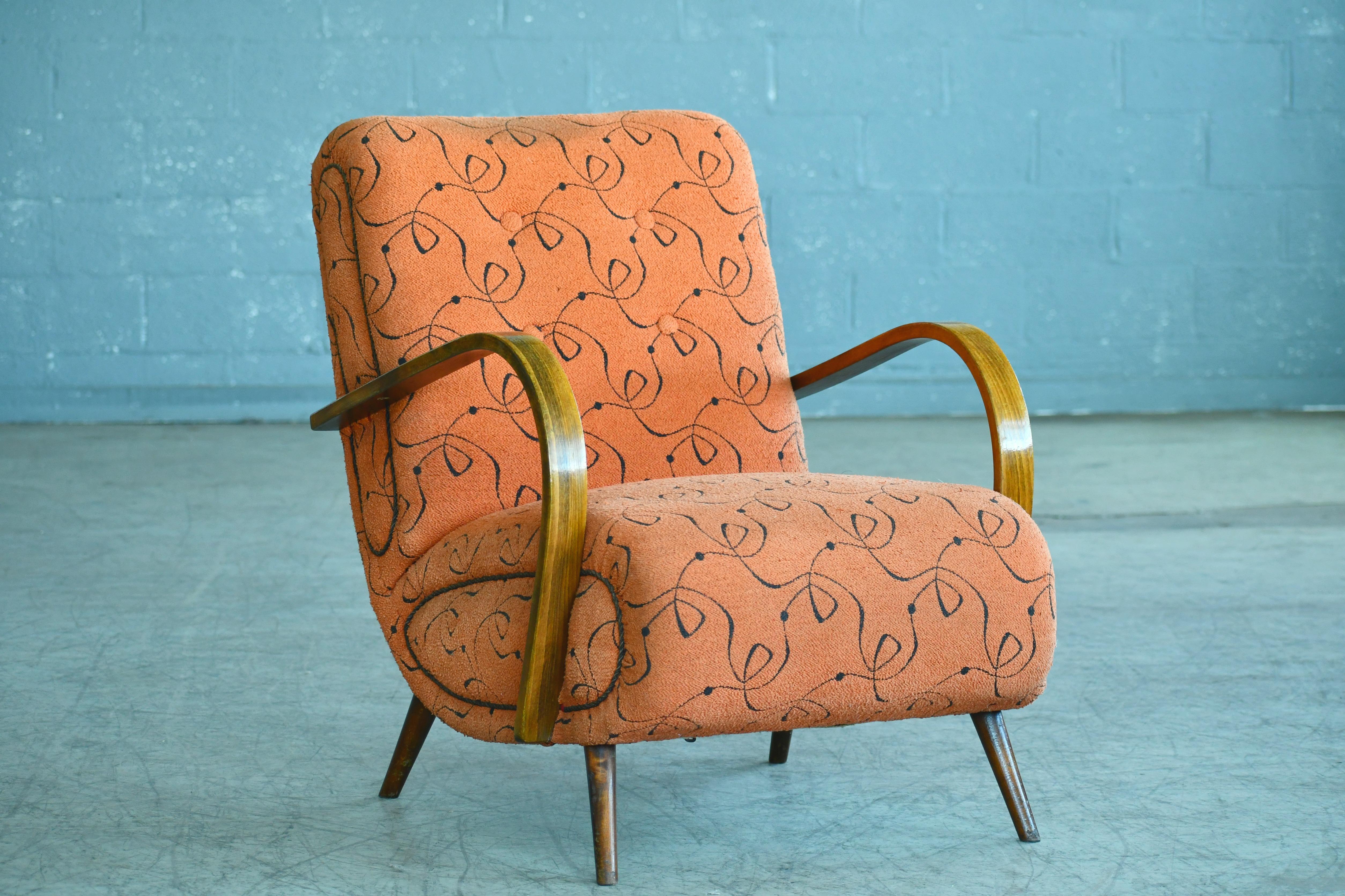 Very cool Paolo Buffa-style lounge chair, circa 1950s. The chair is unmarked and the maker and designer is unknown, we found the this charmer at an auction in Denmark, however. It does look very Italian and a bit Paolo Buffa inspired and the wood