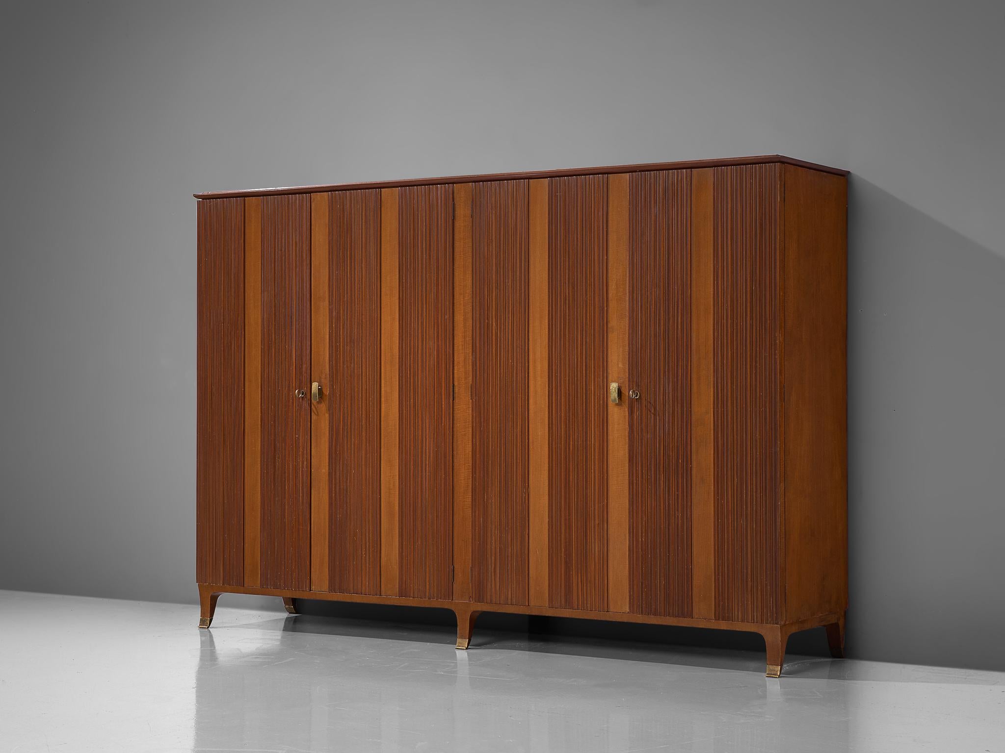 Paolo Buffa, wardrobe or highboard, walnut, ash, beech, brass, mirrored glass, steel, plastic, Italy, 1950s 

Elegant and modern at the same time, this magnificent armoire is by the hand of Italian designer Paolo Buffa. The front is executed in