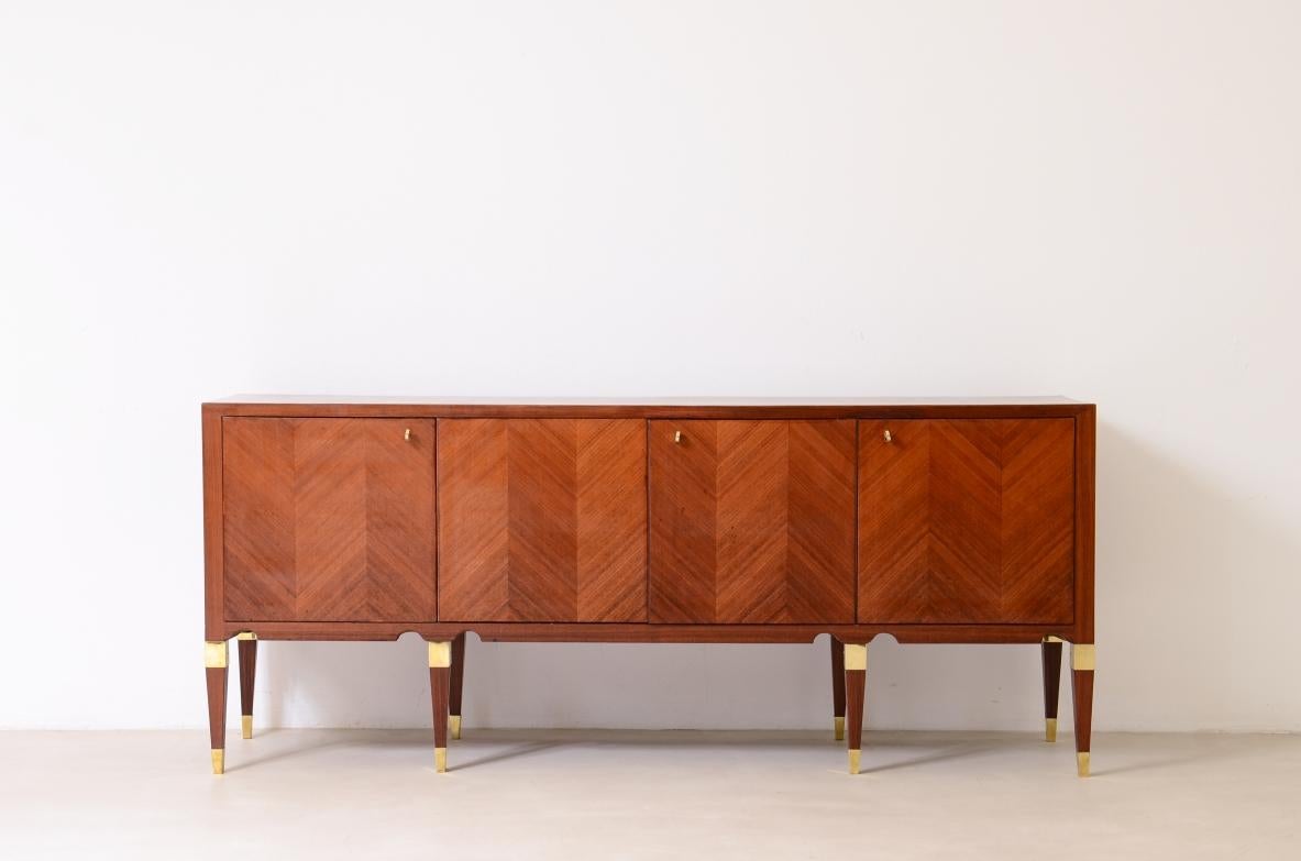 COD-2771
Paolo Buffa

Elegant 4-door walnut cabinet with a herringbone pattern on the front and eight pyramidal legs with half-moons on the band and brass details.

 Italian Manufacture 1950's.

175x40xh75