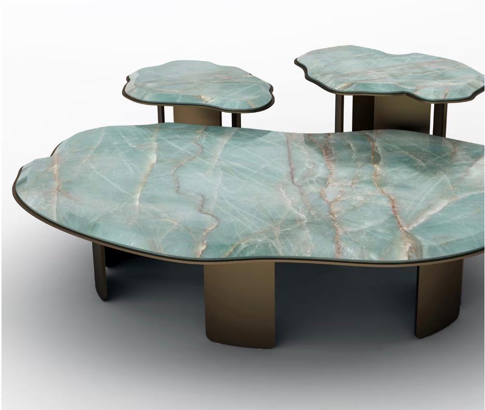 This piece of functional decor belongs to the Claude Collection, which takes its name from the renowned impressionist artist Claude Monet, particularly drawing inspiration from his Water Lilies series. The tabletop is meticulously crafted from