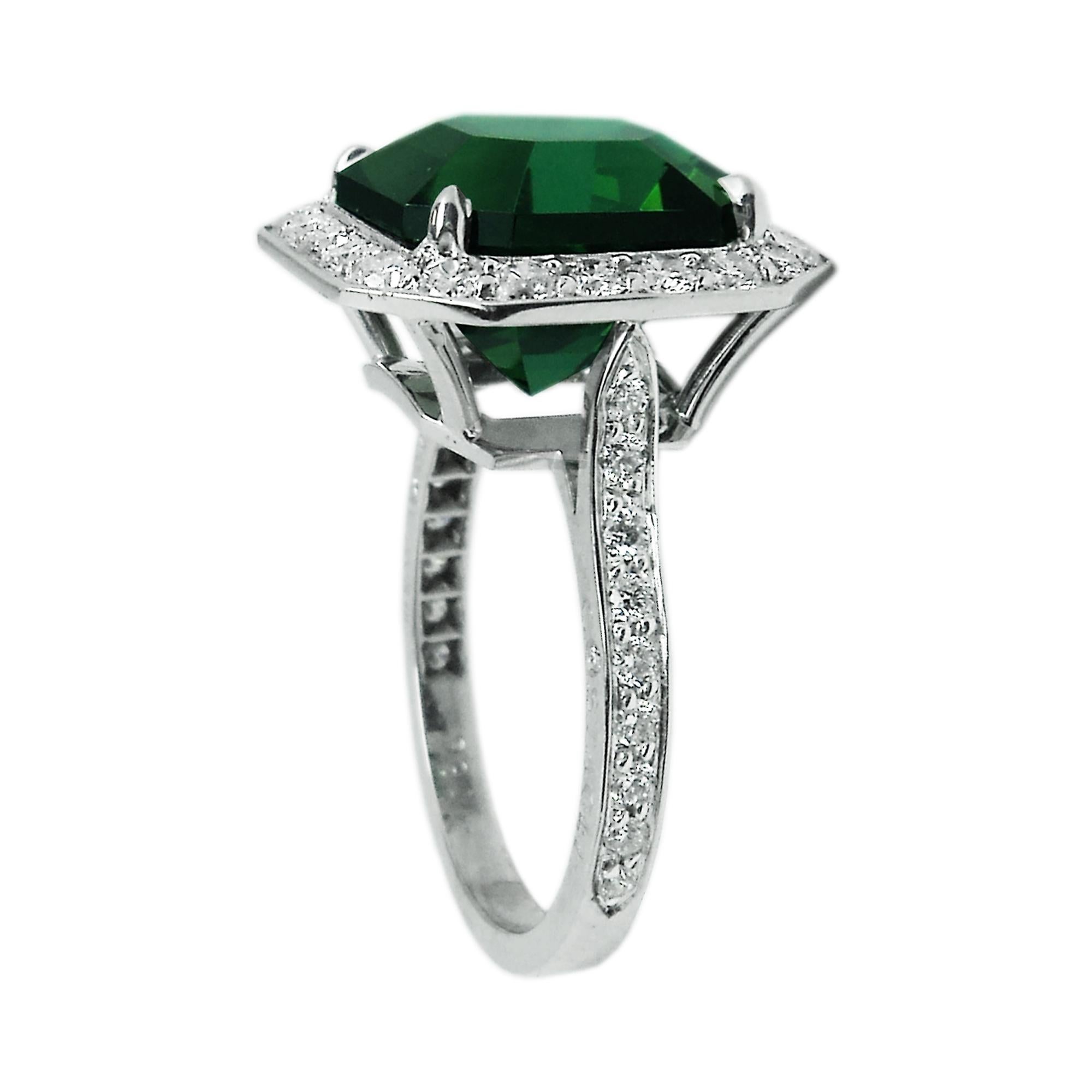 18 karat white gold ring set with an exquisite Asscher cut green tourmaline and round, brilliant diamonds. 

This unconventional tourmaline ring is a shining example of Paolo's expertise. Gemstone engagement rings are the perfect alternative to the