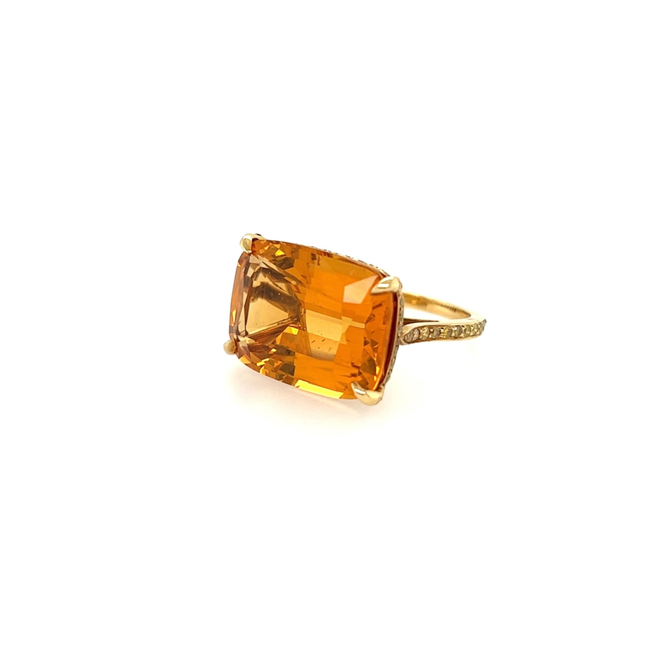 An 18 karat yellow gold, citrine and yellow diamond ring. Paolo Costagli. horizontally set with a cushion cut citrine, measuring approximately 18.0 x 13.3mm, with pave set yellow diamond gallery and shank. Size 4 1/2, gross weight is approximately