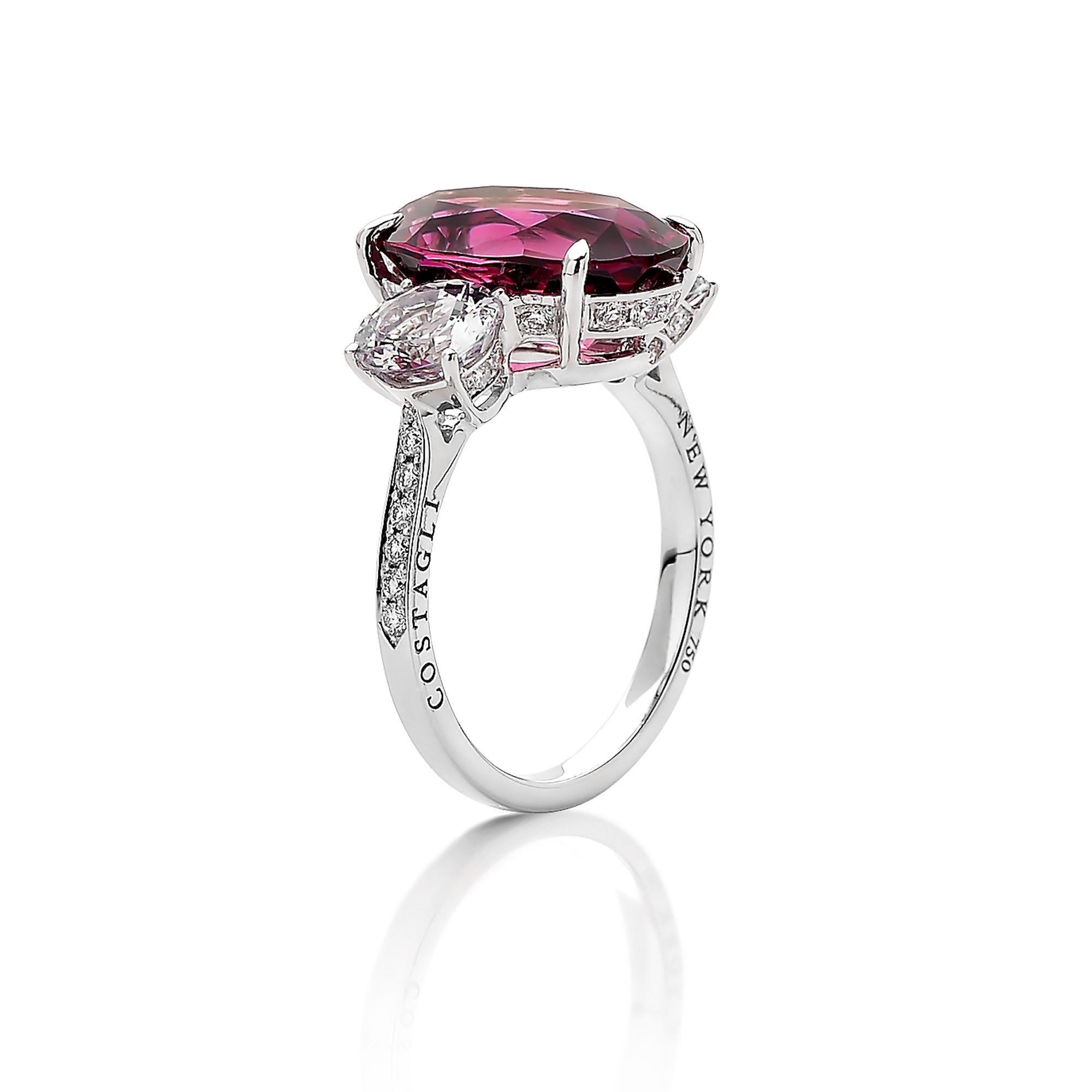 One of a kind 18 karat white gold oval-shape rhodolite garnet ring with white spinel side stones and pave-set round, brilliant diamonds. 

Each Paolo Costagli contemporary engagement ring is a one of a kind, handcrafted testament to your love story.