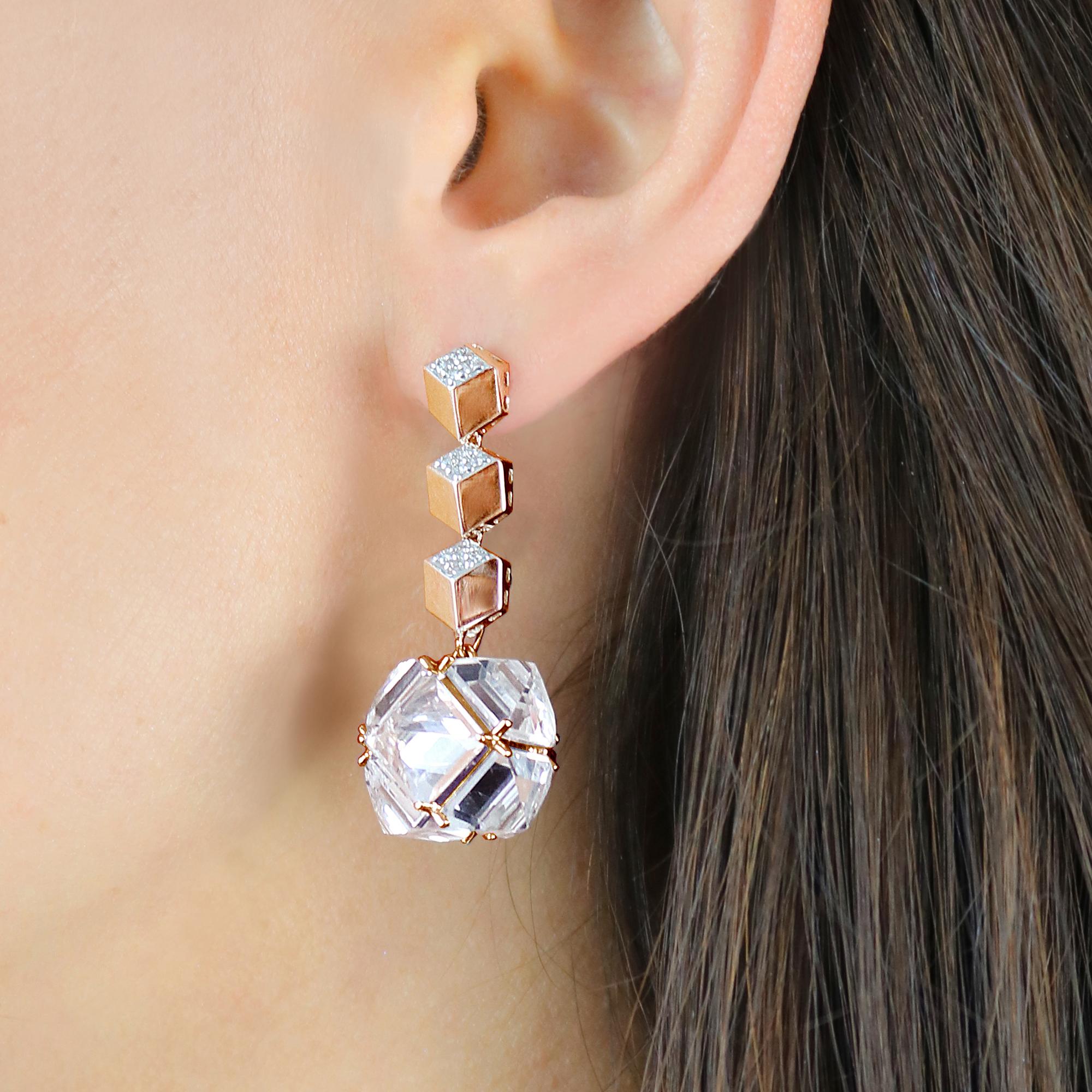 High polish 18 karat rose gold Brillante® earrings with pave-set diamonds paired with reverse-set emerald-cut white topaz earring pendants from the Very PC®collection. 

Staying true to Paolo Costagli's appreciation for modern and clean geometries,