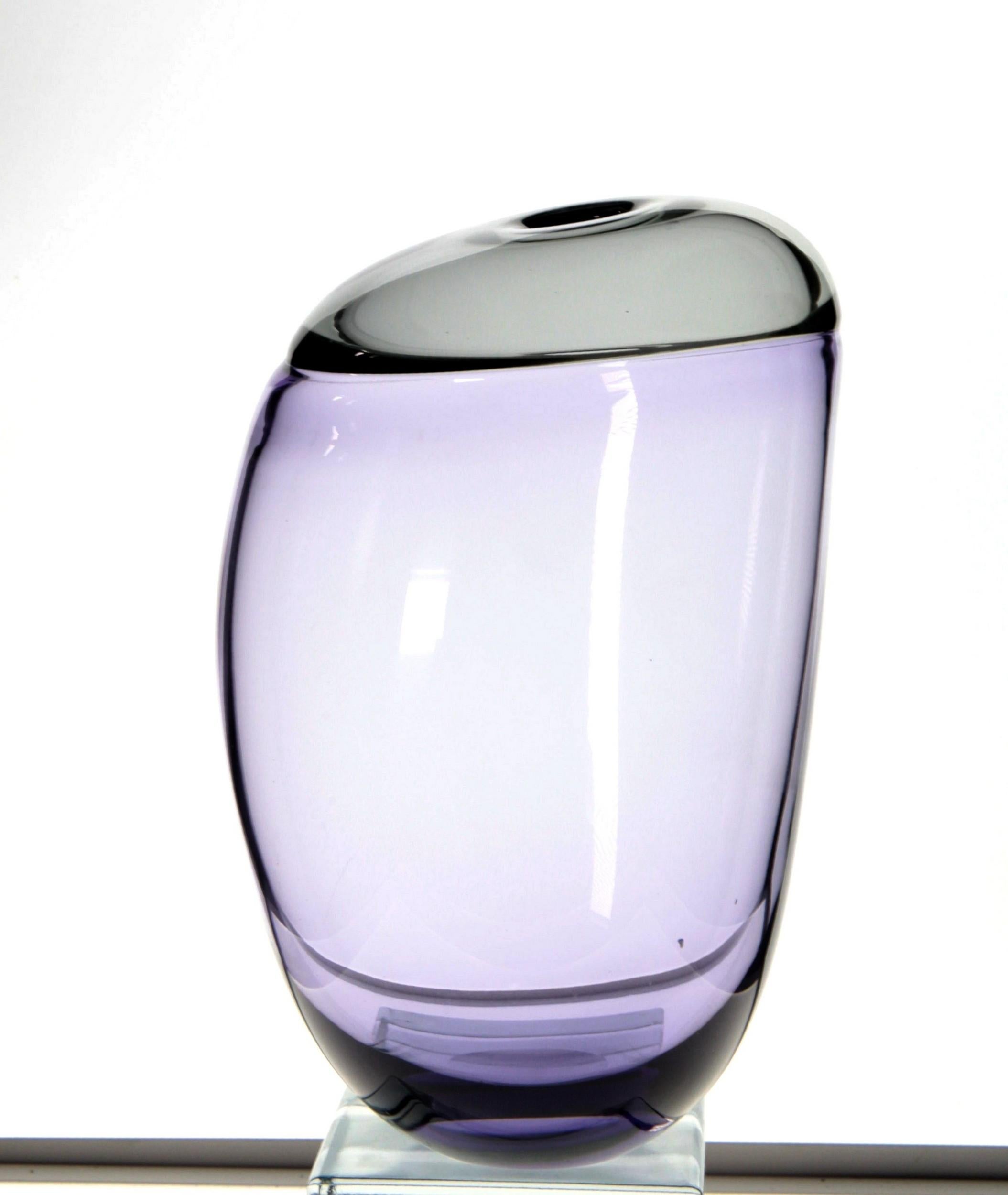 Paolo Crepax asimmetrico vase. The vase made of two separate parts joined together called incalmo. The main part is in a beautiful amethyst, the upper part is in Grigio Acciaio (a warm gray). 

Paolo is famous for his ability with the incalmo