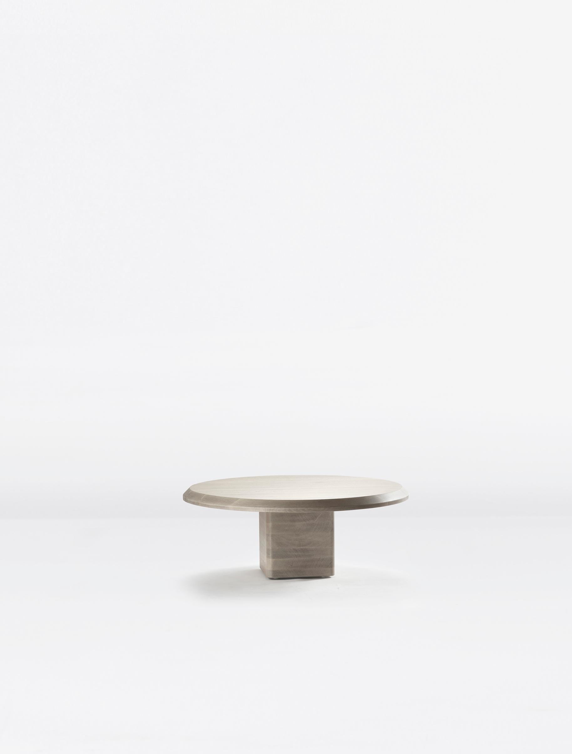 A solid wood low table with a soft radiused base and wide beveled top.

Paolo Ferrari is an internationally recognized designer and founder of Studio Paolo Ferrari, a Toronto-based, multi-disciplinary design studio, with a focus on interiors and