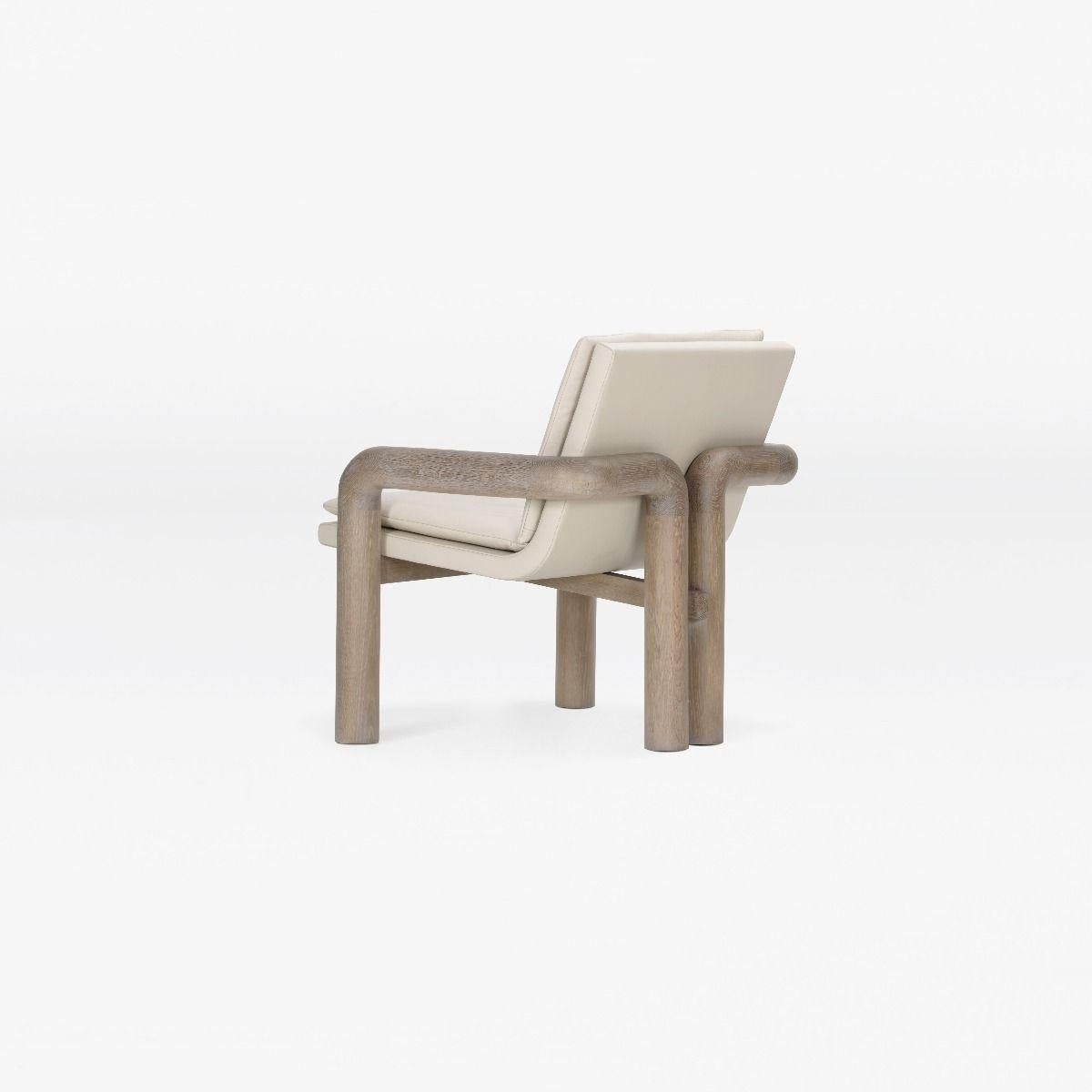 A small scale lounge chair, with solid wood armrest and sculpted double back leg detail.

MATERIALS
Shown in Leather Solid White Oak / Limed Medium Stain 01-SF

MEASUREMENTS
27.25”W x 28.75”D x 30”H x 15.5” SH

HANDMADE IN CANADA

PRICING
