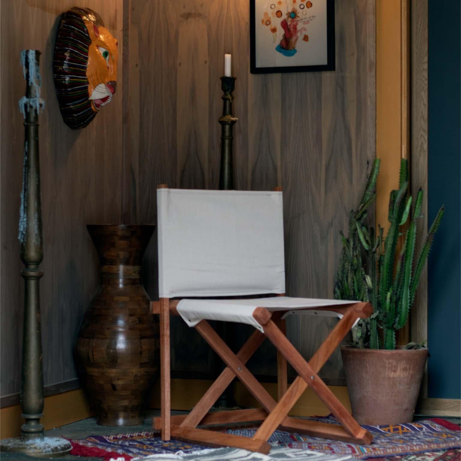 The Paolo Director's Chair is crafted from solid mahogany wood, paired with vintage style heavy loomed canvas. The chair is in the spirit of the classic director's chair meets safari chair style. The Paolo chair is collapsable in two pieces. Crafted