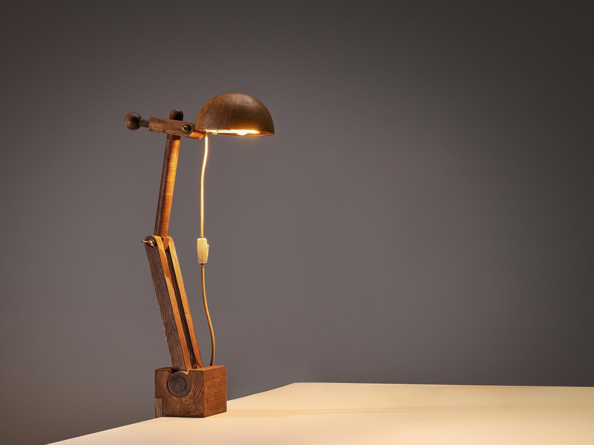 Paolo Pallucco for Pallucco Roma, desk lamp, chestnut, Italy, 1960s

A distinctive clamp desk lamp, thoughtfully designed by Paolo Pallucco, not only offers functionality but also visual appeal. Crafted from solid chestnut, it features a