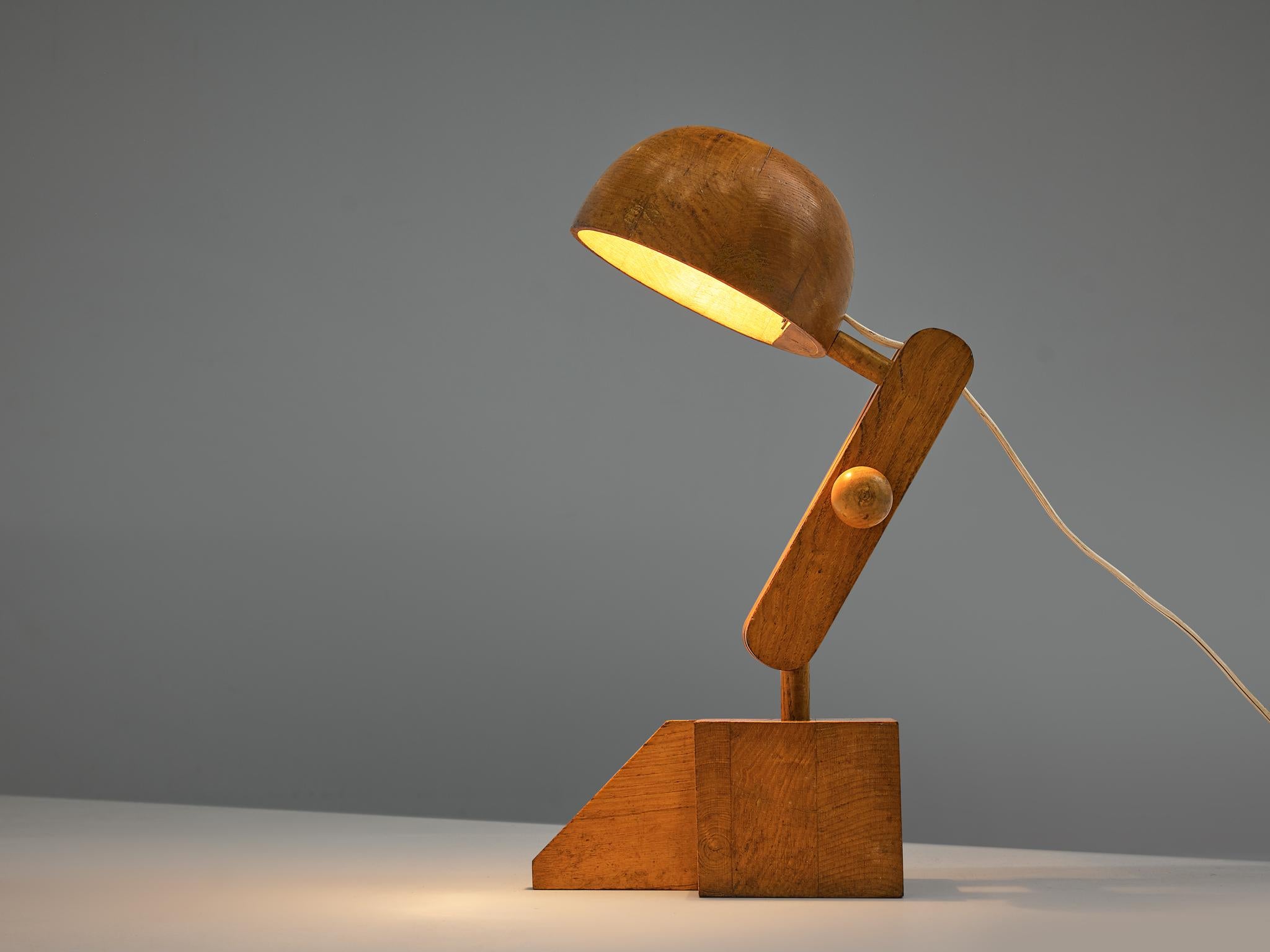 Paolo Pallucco for Pallucco Roma, table lamp, solid oak, Italy, 1960s

Functional yet playful desk lamp in characteristic material and shape. Paolo Pallucco used solid oak for his design of an adjustable desk lamp. A cube with extensive slat forms