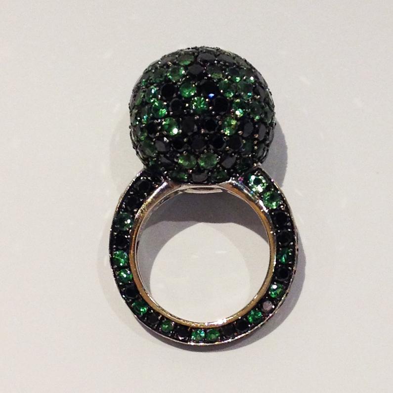Ring in 18kt pink gold which sets Black Diamonds for 8,20cts, Tsavorite for 9,50cts.

Unique piece, designed and handcrafted in Italy, by visionary goldsmith Paolo Piovan. 

Paolo Piovan Jewels, creations of the purest expression of Italian design