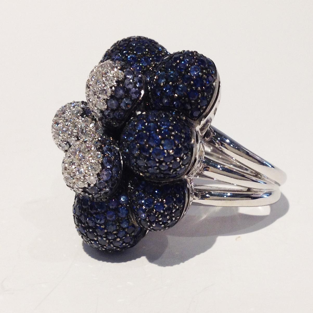 Ring in 18kt white gold which sets Blue Sapphires for 10,72cts, White Diamonds for 1,33cts.

Unique piece, designed and handcrafted in Italy, by visionary goldsmith Paolo Piovan. 

Paolo Piovan Jewels, creations of the purest expression of Italian