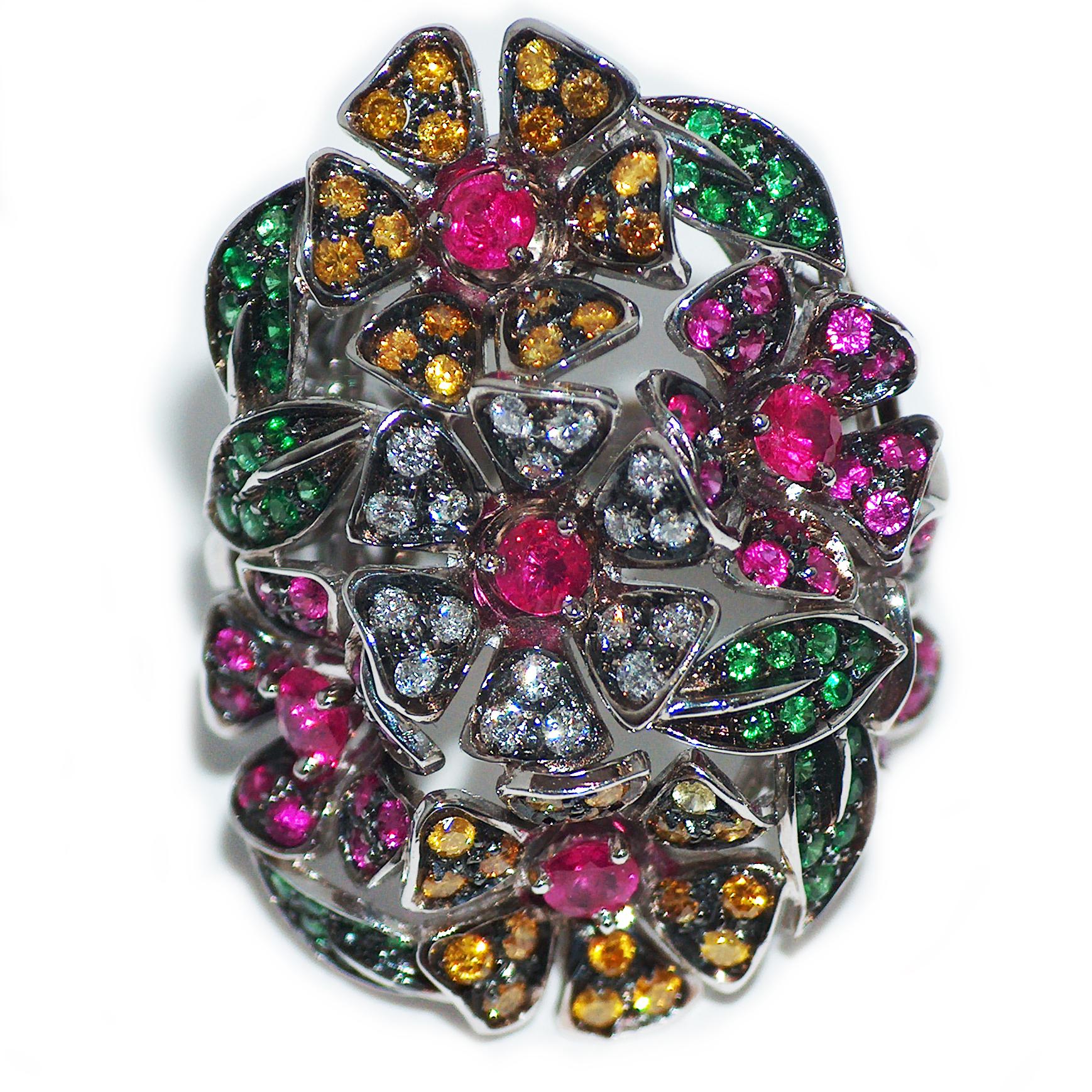 Ring in 18kt white gold which sets White Diamonds for ct. 0,62, Yellow Diamonds for ct. 0,66, Rubies and Sapphires for ct. 1,16 and Tsavorites for ct. 0,82. 

Unique piece, designed and handcrafted in Italy, by visionary goldsmith Paolo Piovan.