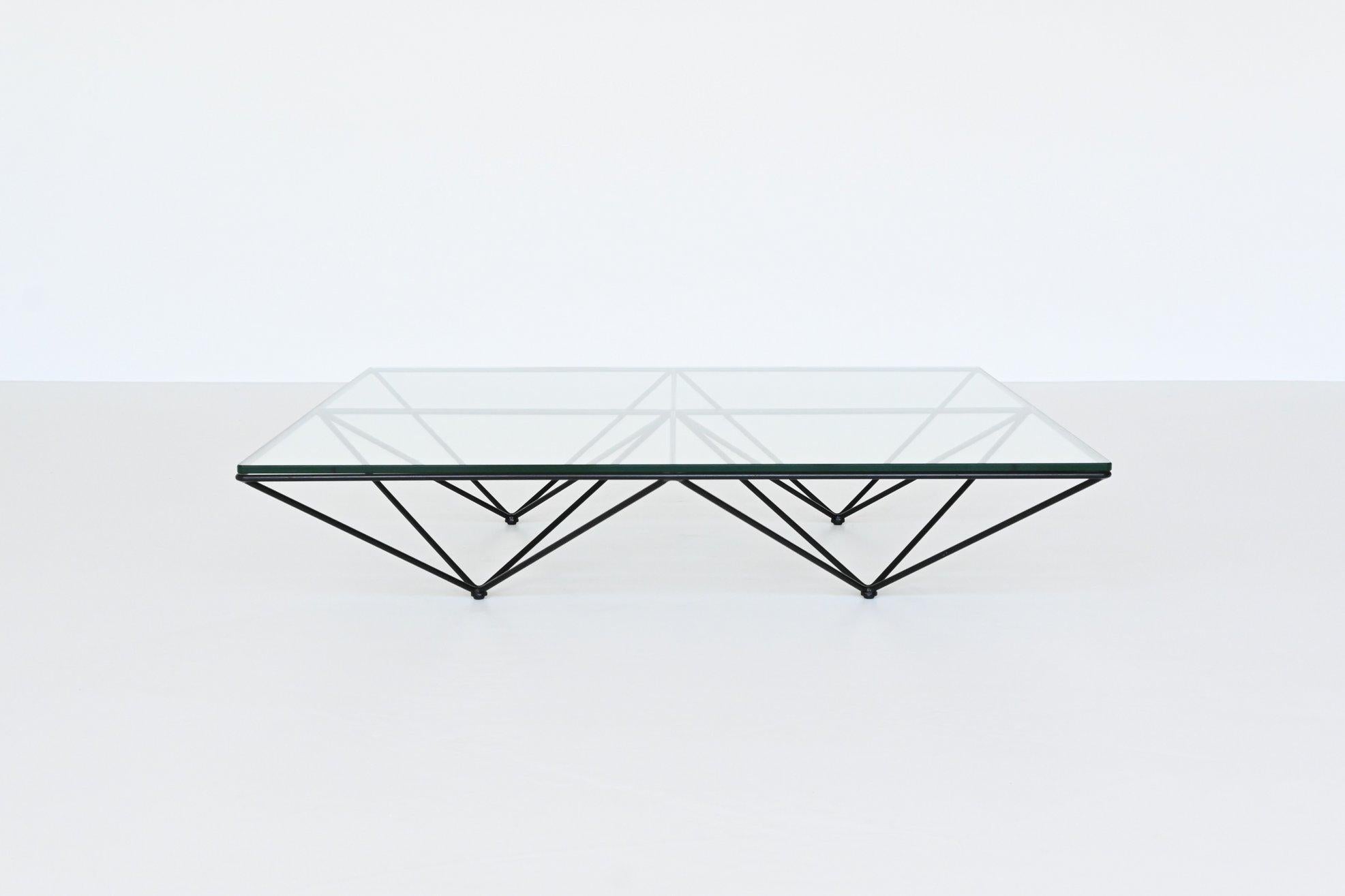 Beautiful modernist coffee table model Alanda designed by Paolo Piva for B&B Italia, Italy 1982. This spectacular geometric coffee table has a solid black lacquered metal frame, connected like a spider web. The low base supports a thick glass top