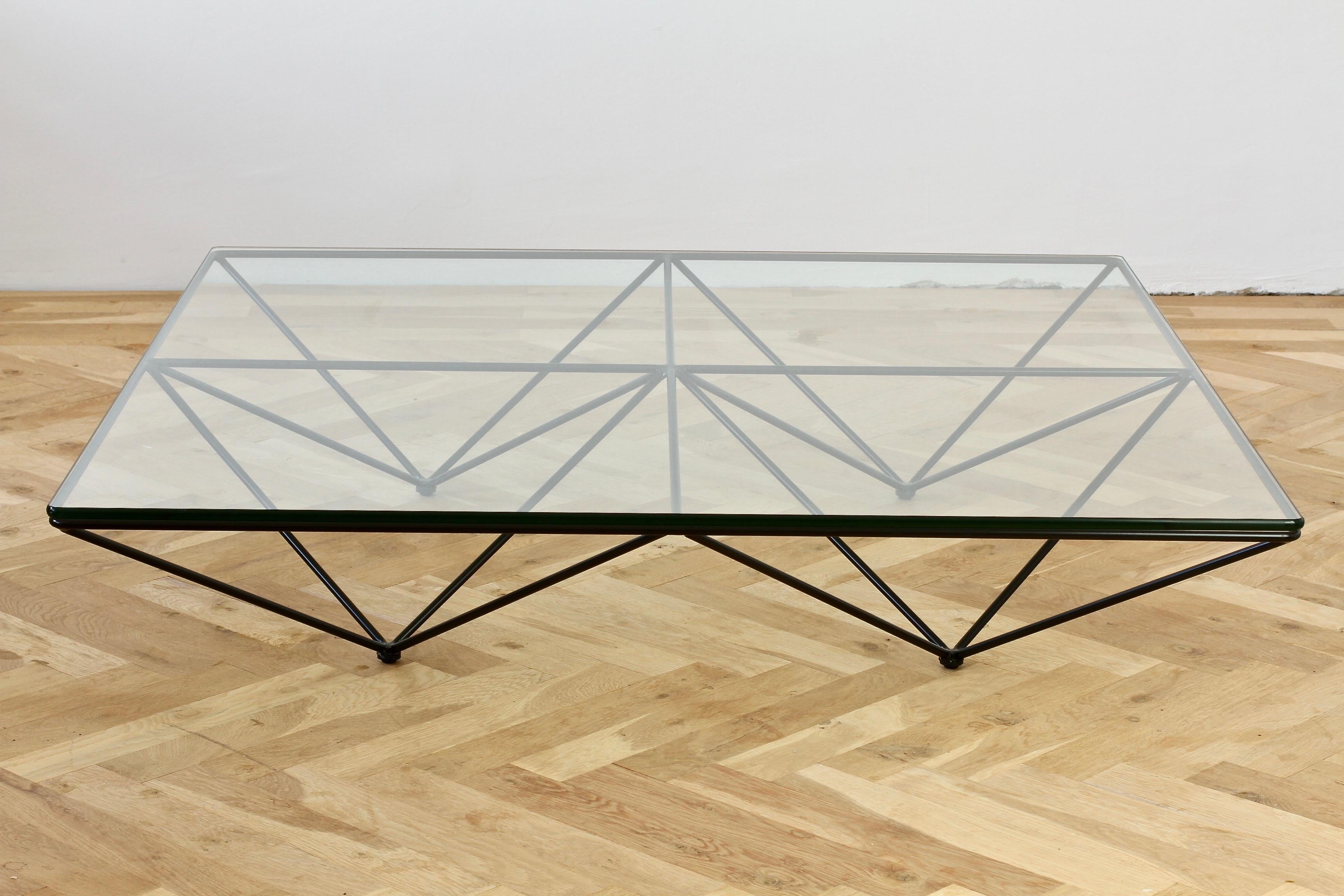 Paolo Piva for B&B Itlaia 'Alanda' low coffee table, 1982. The modernist and minimalist design is simply fantastic the rounded edged clear glass tabletop sits on top of the bold, black painted, geometric steel metal frame which blends so well with a