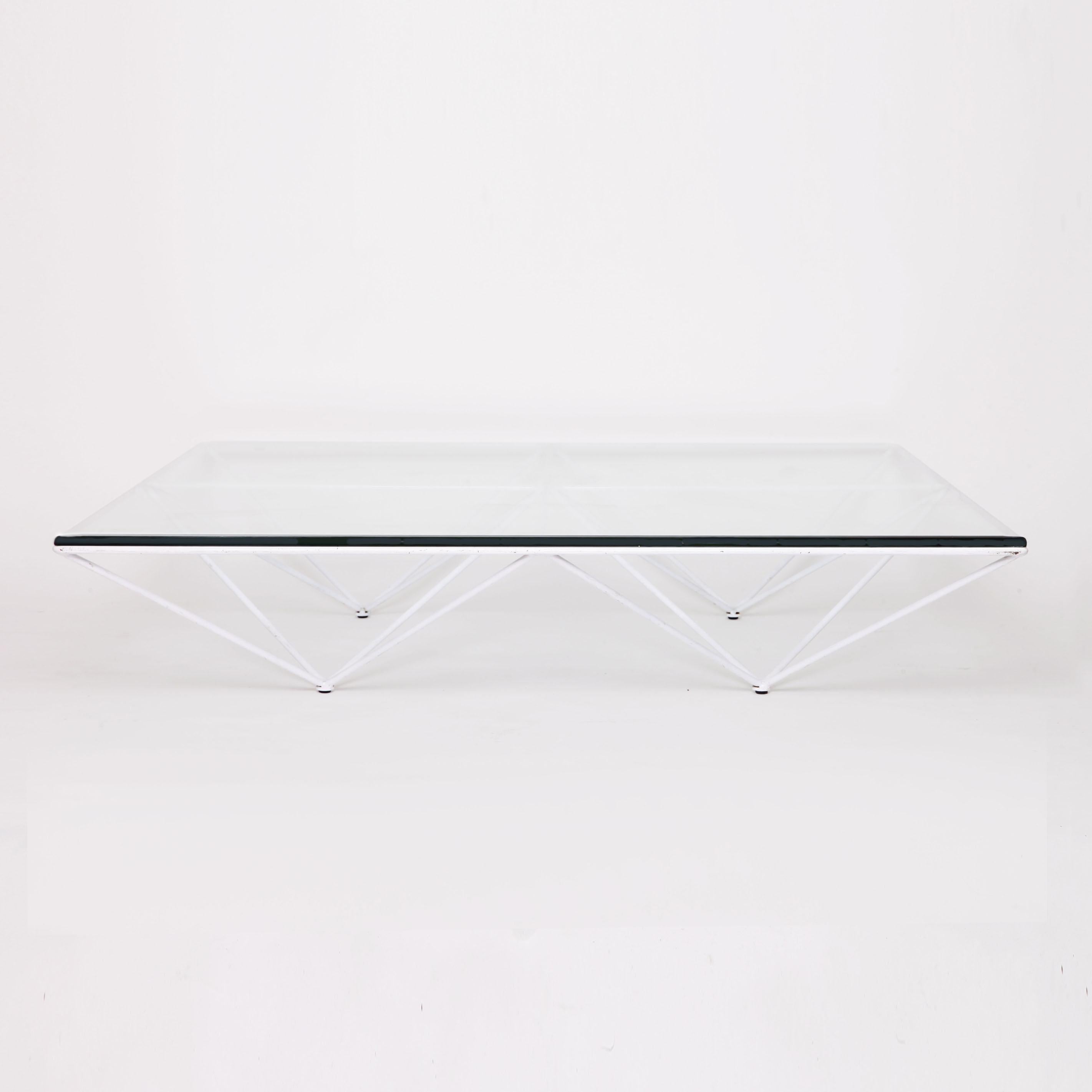 White enameled steel rods with 1cm thick plate glass top coffee table by Paolo Piva. The Alanda low coffee table editioned by B&B Italia circa 1980s and is not in production any more. The Alanda table mainly produced in black and is very rare to