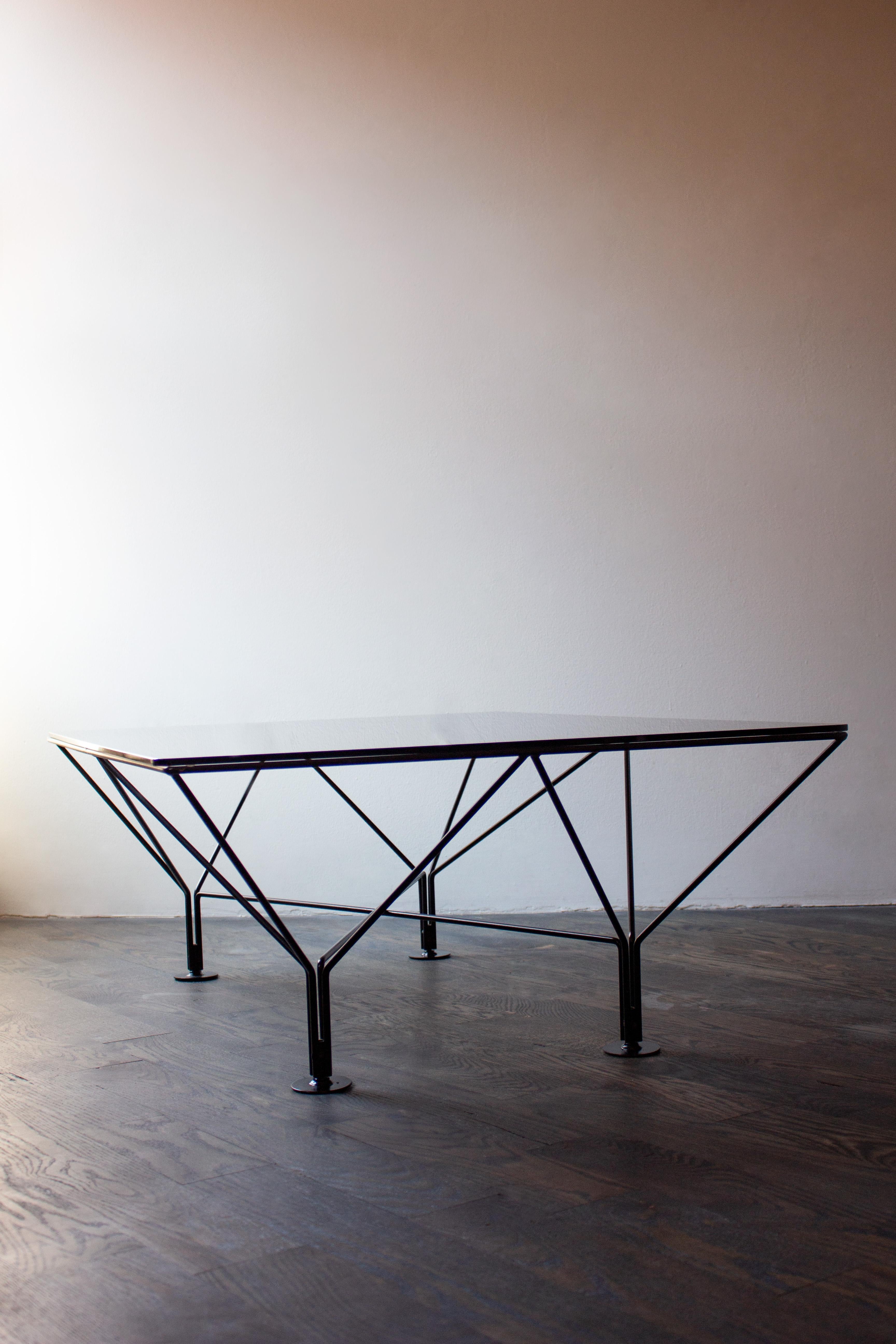 This Italian coffee table in the style of Paolo Piva for B & B Italia, features black metal frame with a smoked glass top, circa 1980s.
 