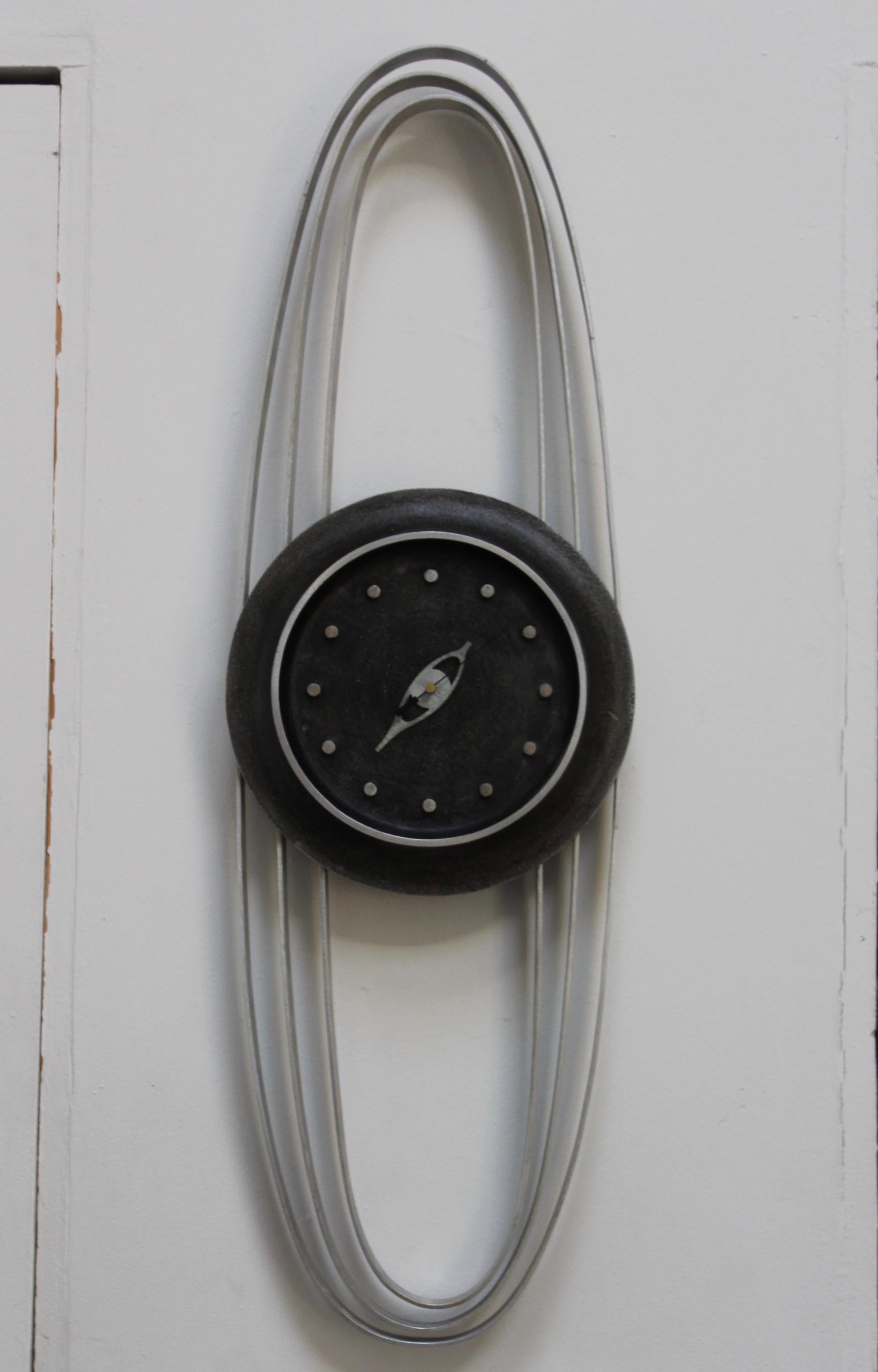 1970s Mid-Century Modern aluminum wall clock designed by Paolo Rizzato.