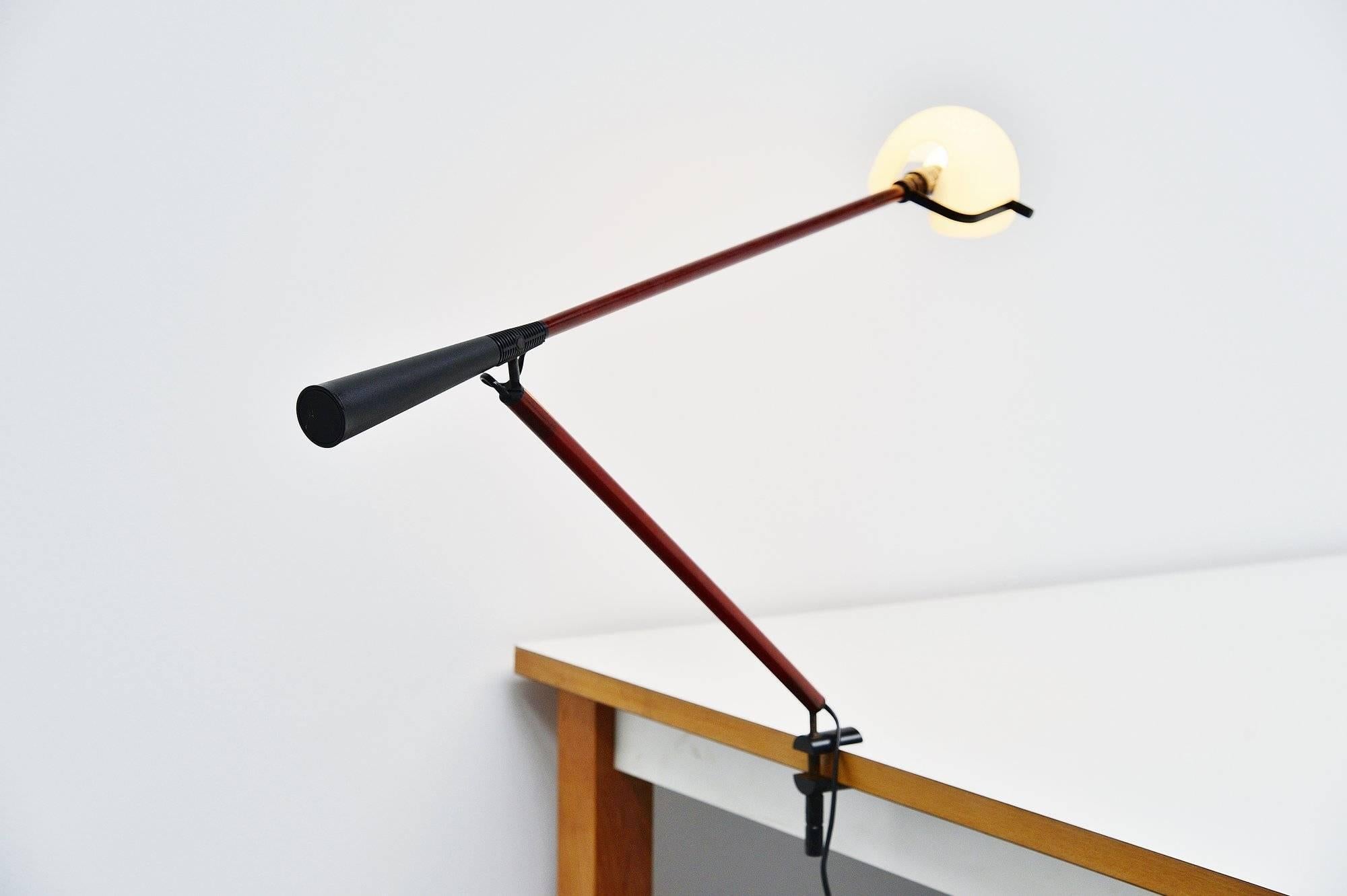 Very nice and multifunctional desk or table lamp by Paolo Rizzatto for Arteluce. This is model number 612 manufactured by Arteluce in 1975. This lamp has a clamp to attach to a table or desk and contra weight at the end of the arm, fully adjustable
