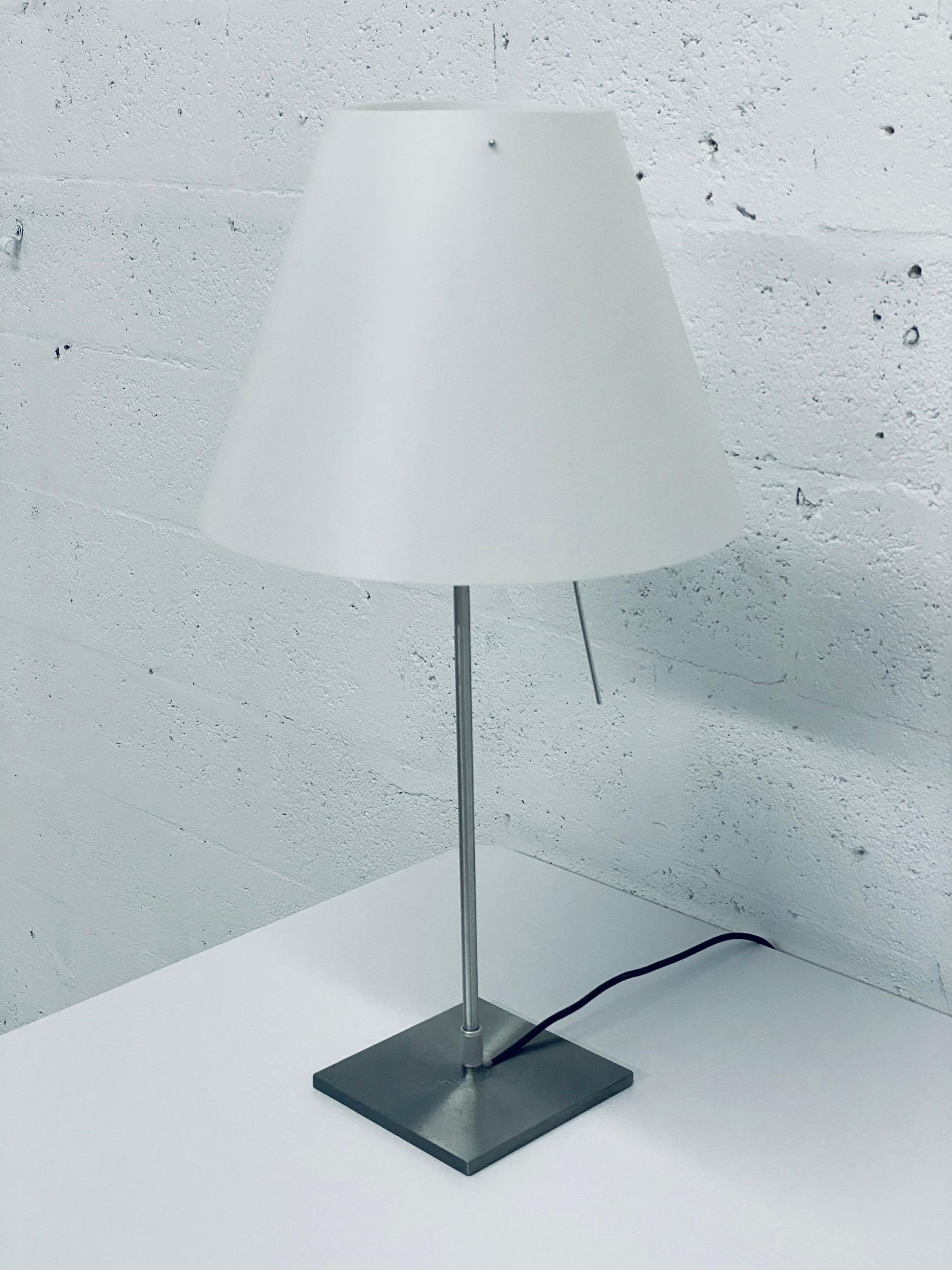 Designed by Paolo Rizzatto, the D13 Costanza lamp eliminates a warm pleasant light through the matte white plastic shade. The lamp is dimmable by touching the dimmer rod and has four levels of light intensity and the rod also turns the lamp on and