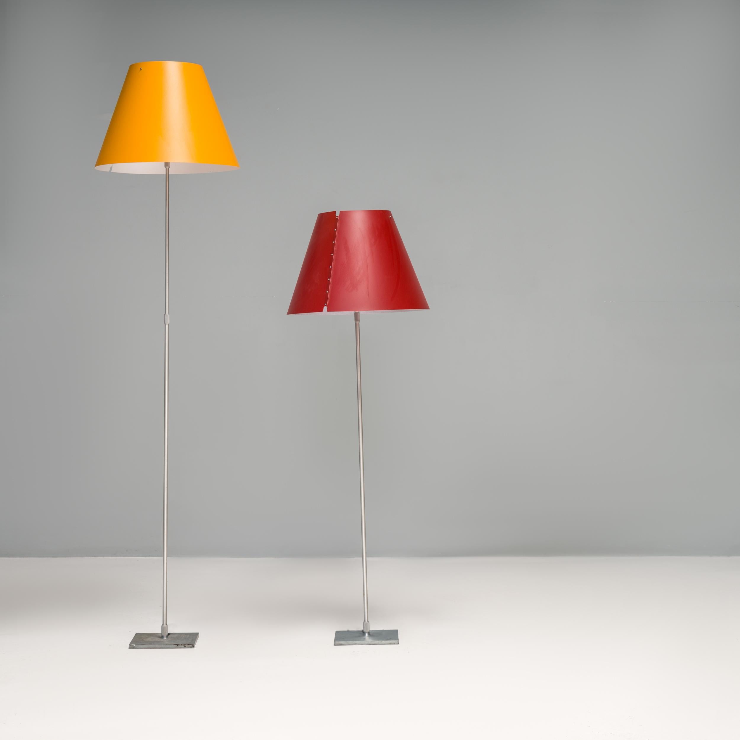 Originally designed by Paolo Rizzatto in 1986, the Constanza floor lamp is a fantastic example of post modern Italian design.

This pair of floor lamps feature the interchangeable polycarbonate silkscreened shades, one in smart yellow and one in