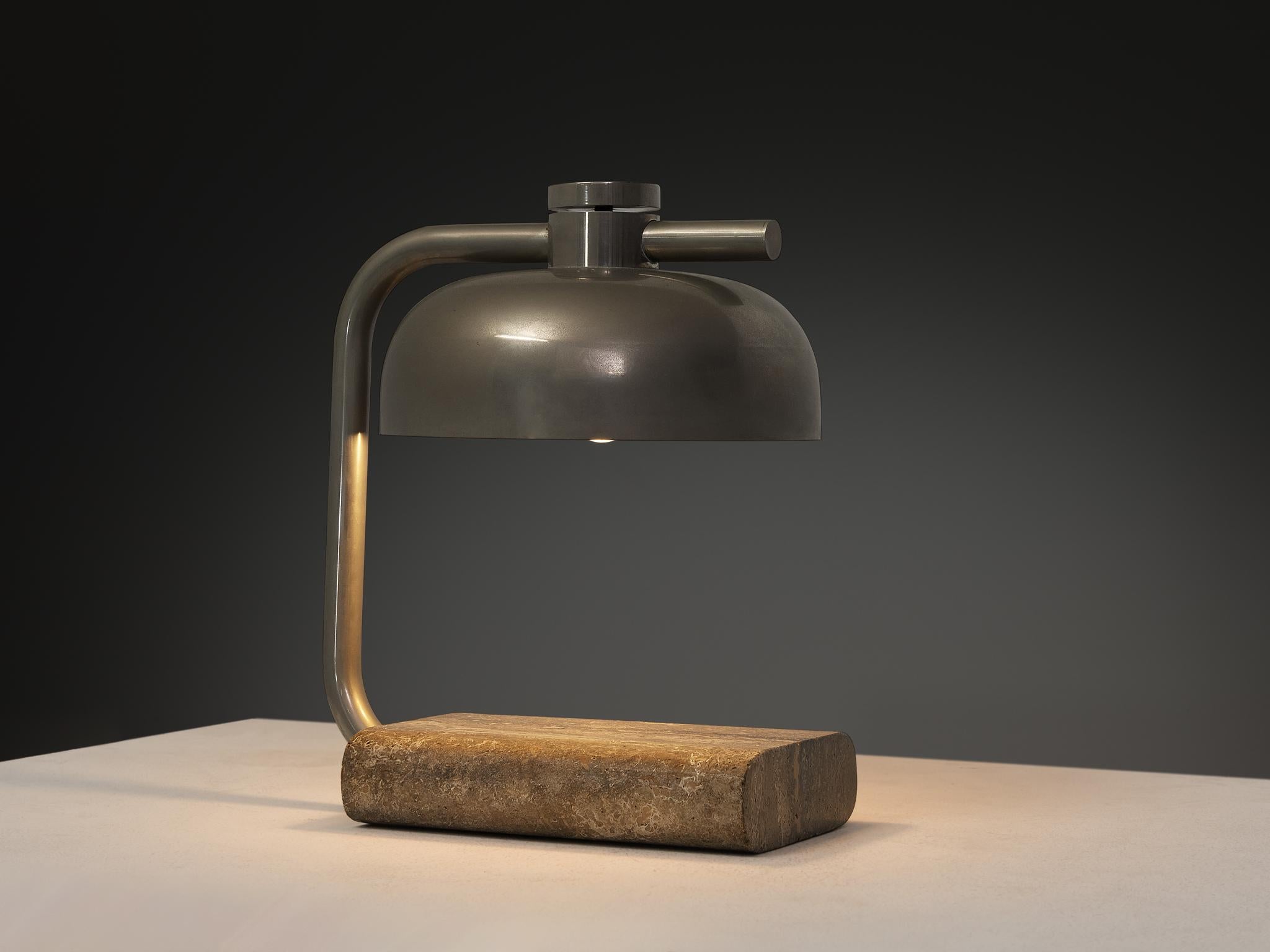 Paolo Salvi, table lamp, travertine, chromed metal, Italy, 1970s

This stunning table lamp features a solid travertine base, showcasing its beautiful natural layers and unique texture on the surface. The elegant stem flows upward, seamlessly