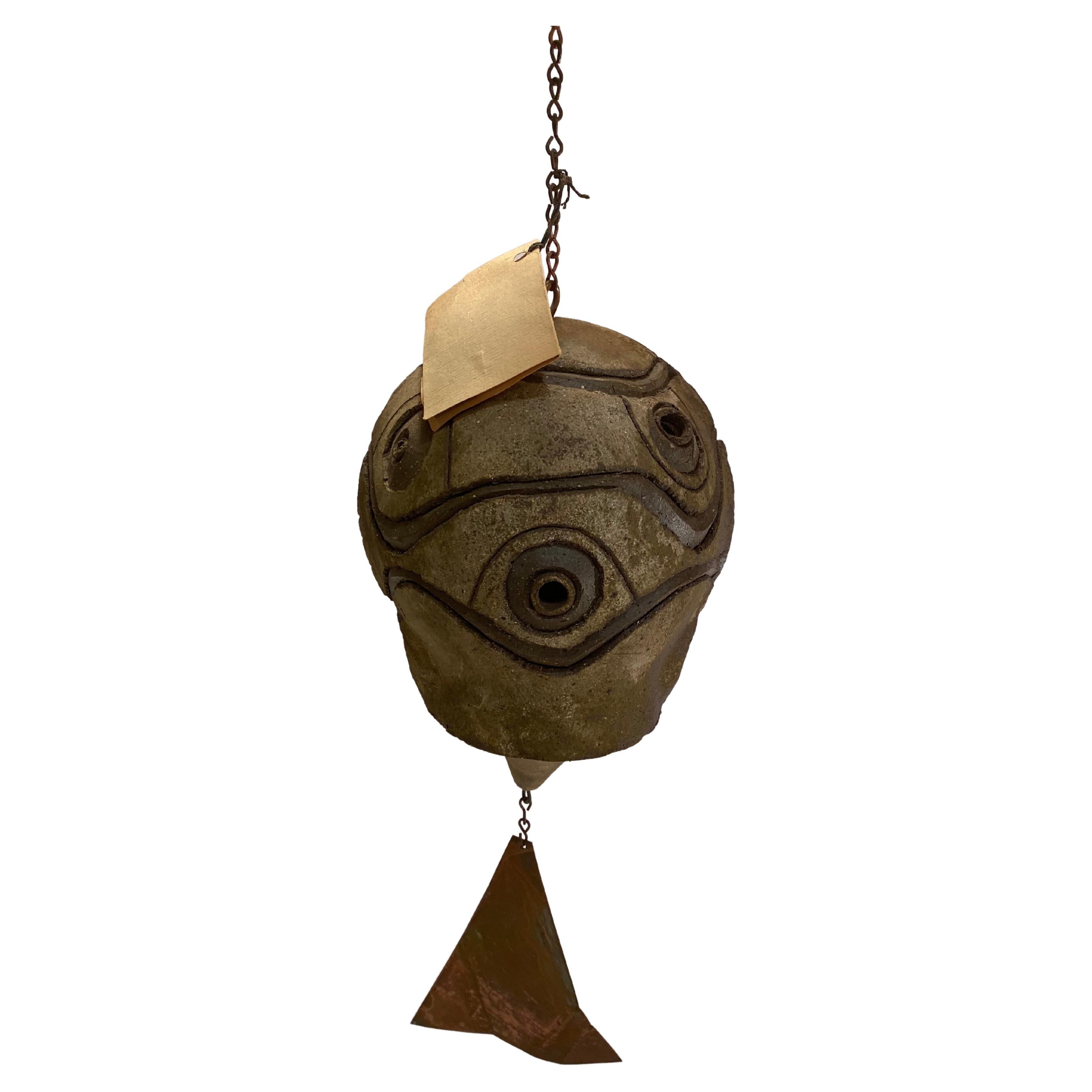 An amazing example of a Paolo Soleri Arcosanti wind and earth bell. Comprised of a earthenware pottery bell, clapper with a copper 