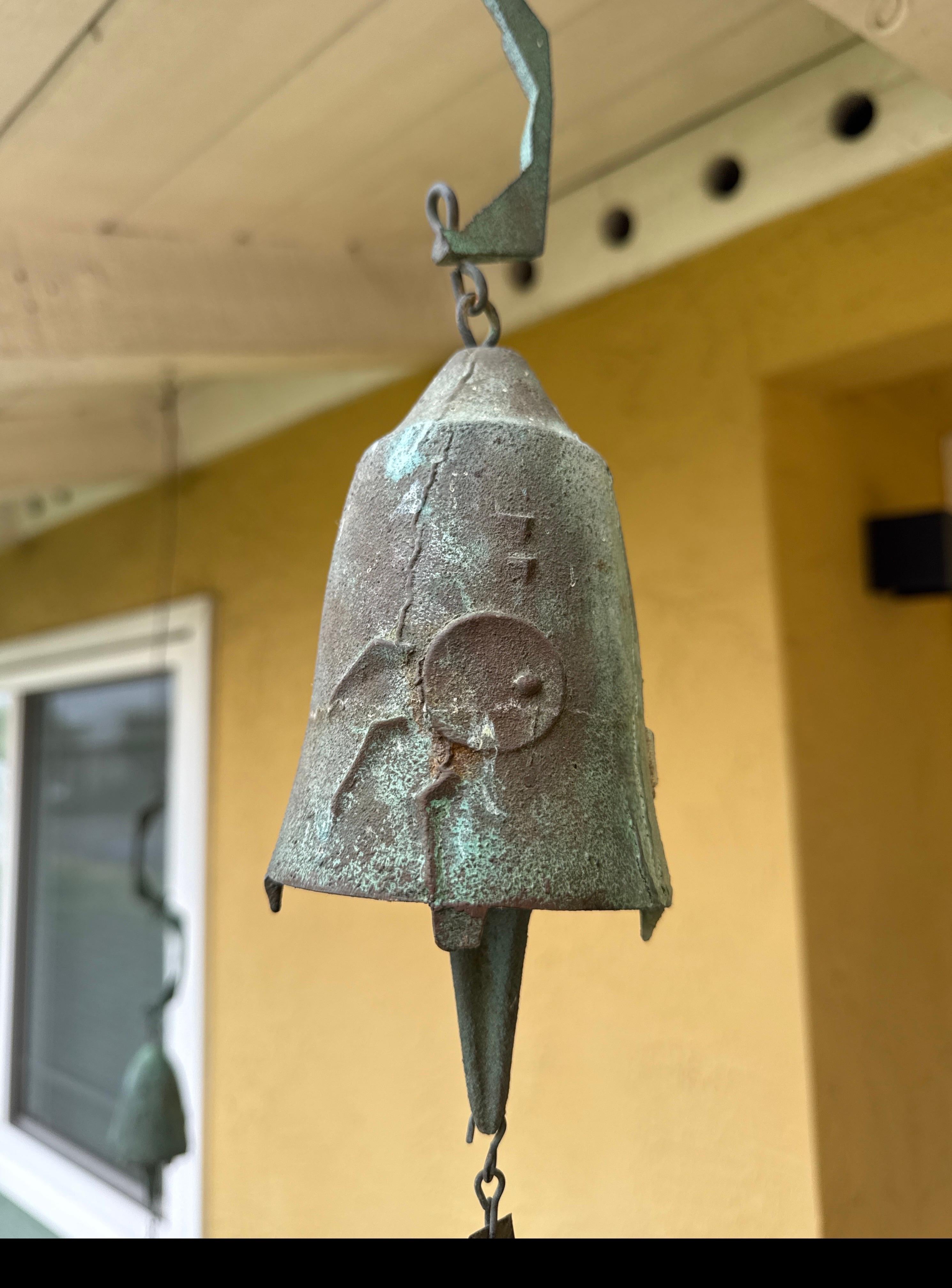This is a vintage bronze bell by Paolo Soleri, cast at Cosanti in Arizona. The bell's body measures 3 5/8