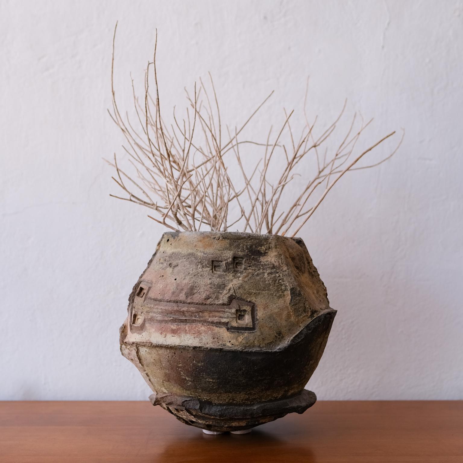 Ceramic vessel by Italian-born visionary architect and artist, Paolo Soleri. Sculptural. Could be used as a planter. The form is reminiscent of the silt-cast concrete buildings at Soleri's Cosanti studio in Arizona. 1960s.

The felt pads are