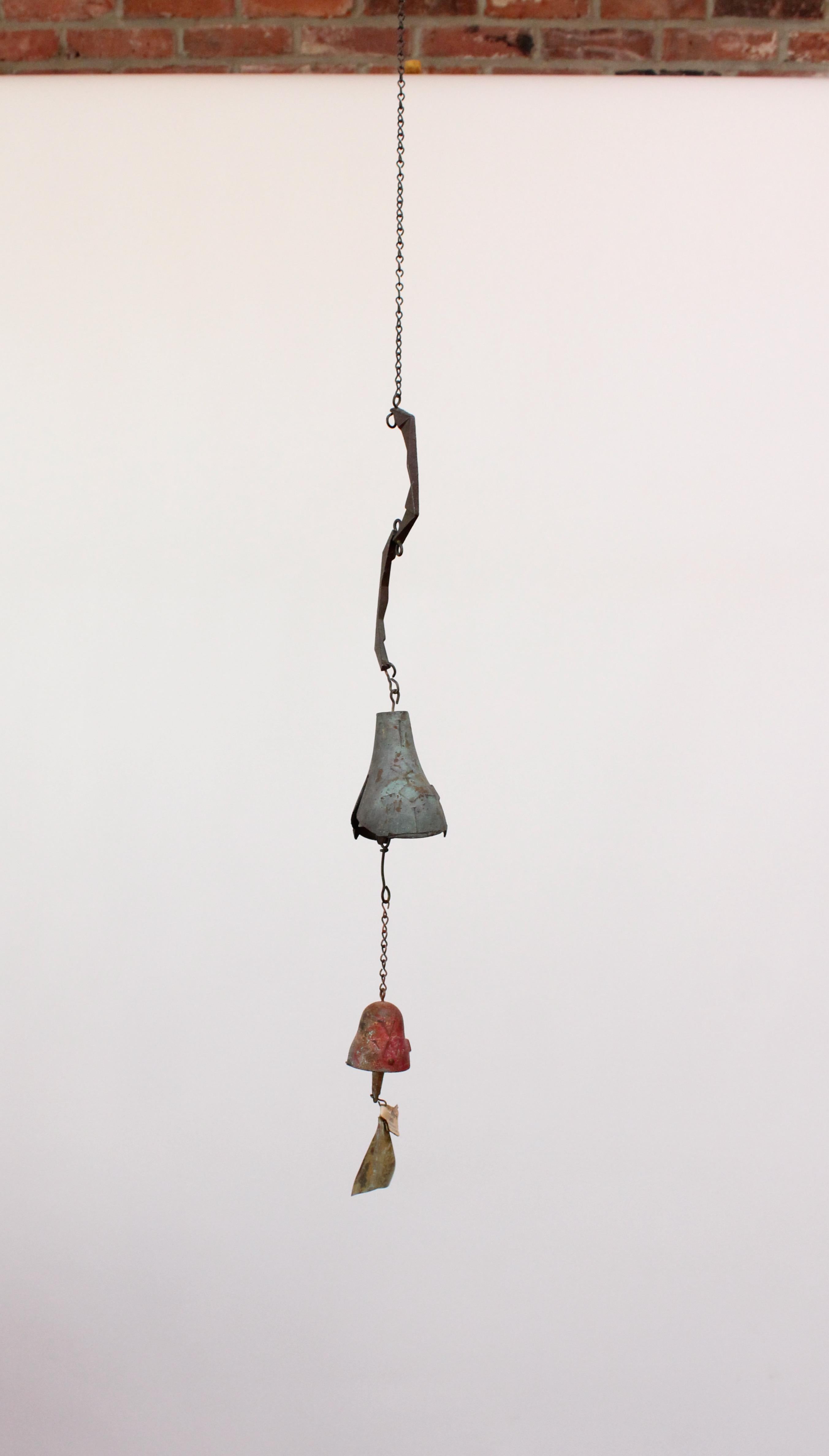 Wind chime / bell designed by architect, Paolo Soleri for Arconsanti (the city he designed and built in Arizona in 1970).
Bronze cast elements with verdigris patina and multi-color pigment throughout. Unique, given its early production and the