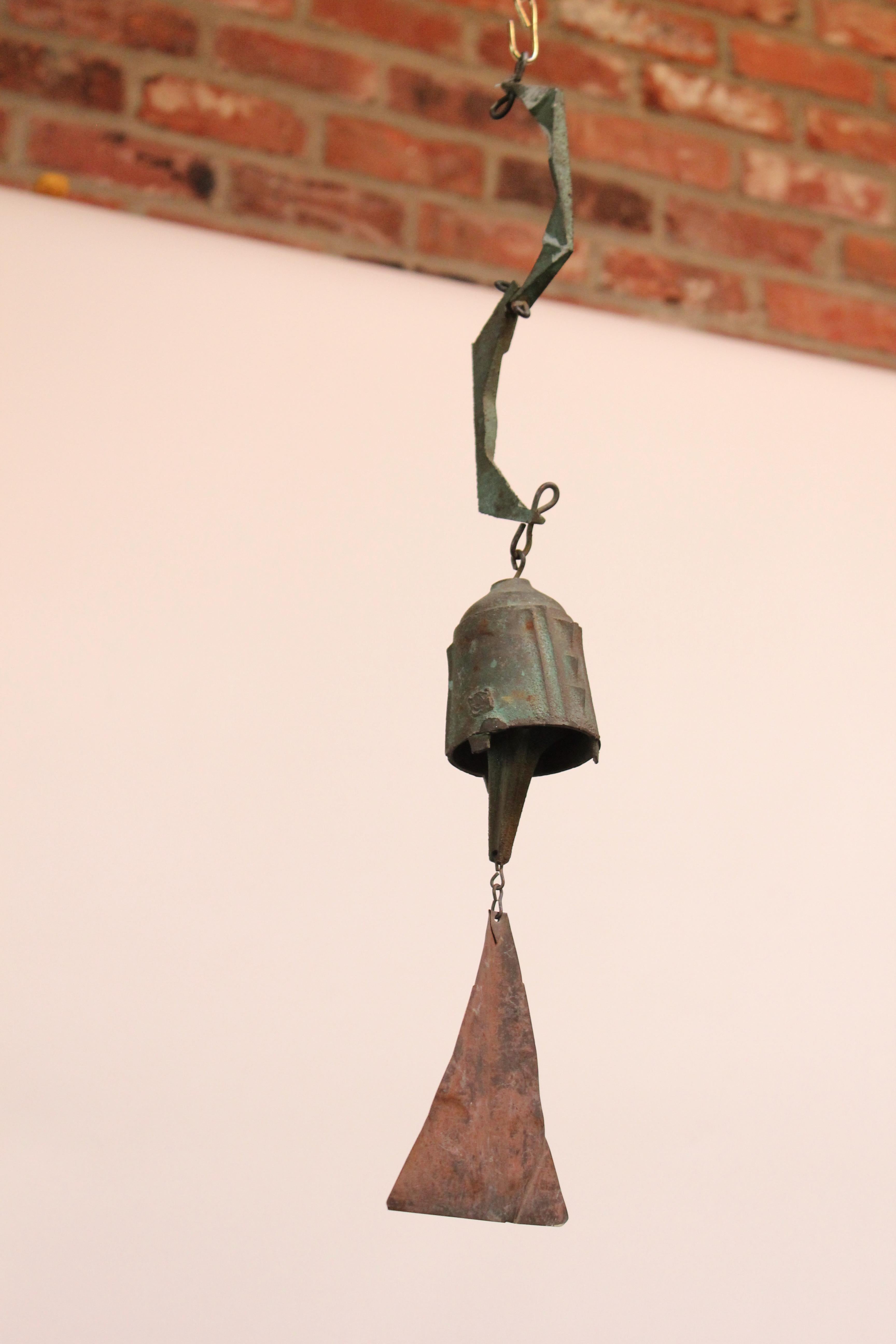 Wind chime / bell designed by architect, Paolo Soleri for Arconsanti (the city he designed and built in Arizona in 1970).
Bronze cast elements with verdigris and oxidized patina throughout from natural age and environmental weathering. 
Branded