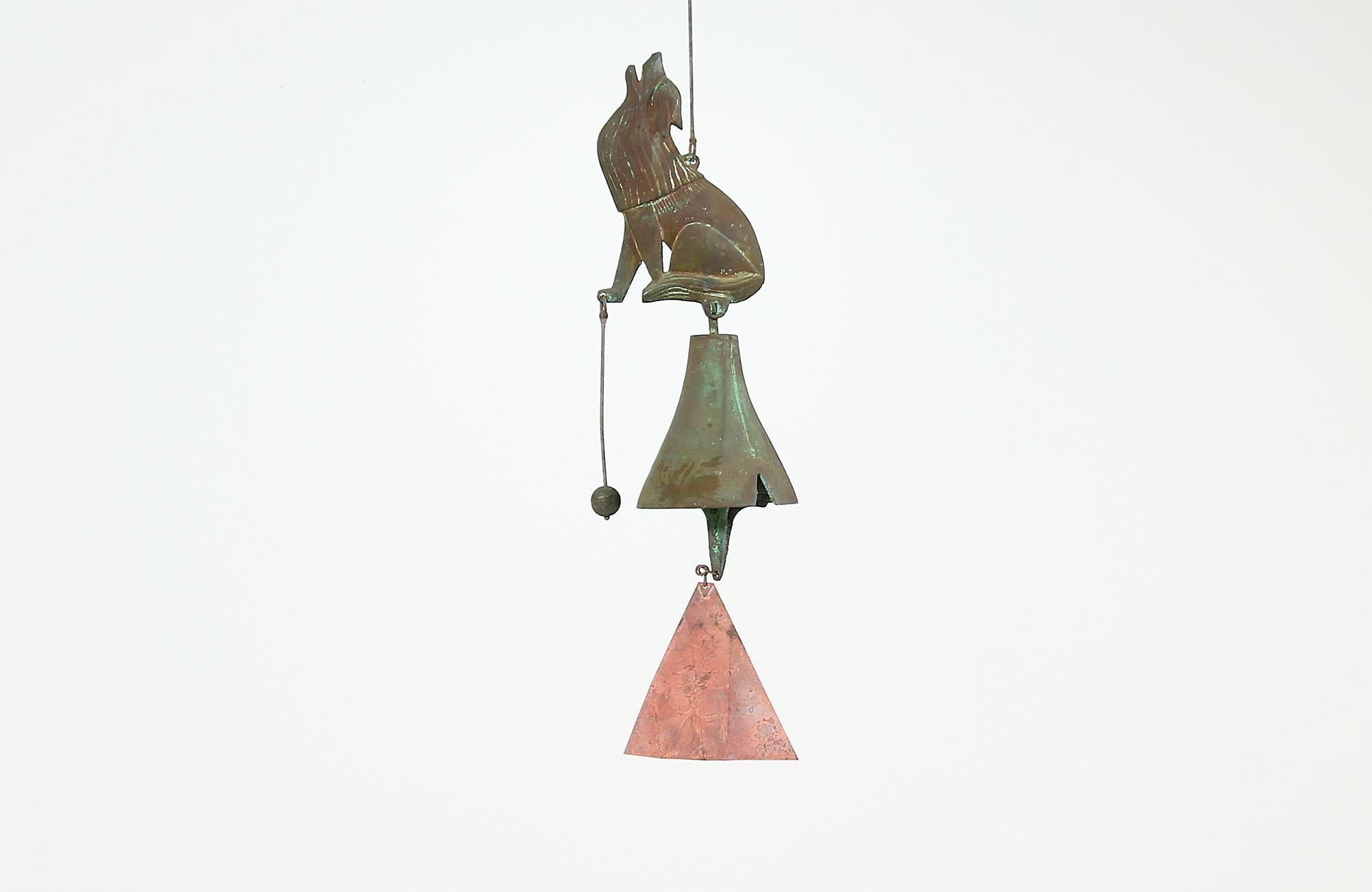 Extraordinary wind chime designed by Paolo Soleri for Arcosanti in the United States, circa 1960s. Featuring a beautiful handcrafted wind chime casted in bronze and copper. The bronze wolf and bell show a gorgeous verdigris patina, while the