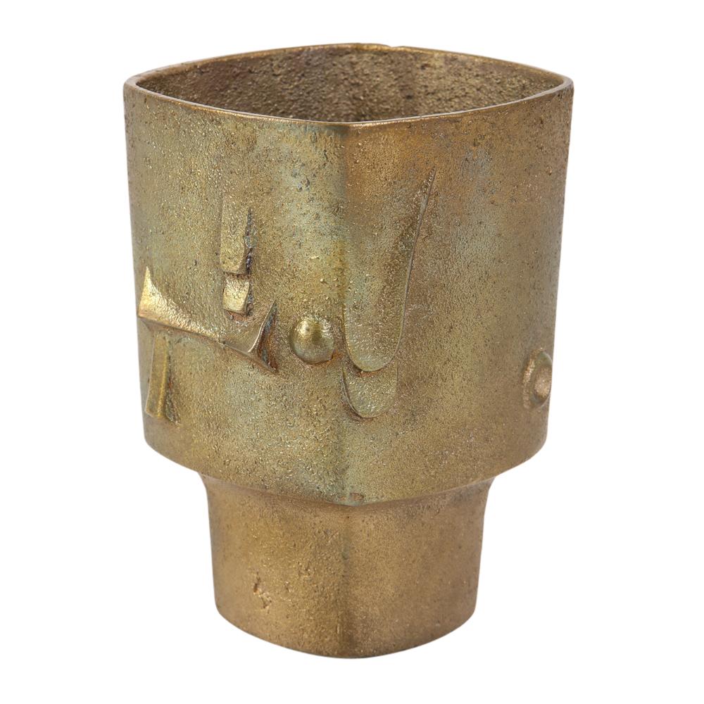 Paolo Soleri vase, bronze abstract, signed. Small scale burnished bronze vase with abstract decoration and footed base. Photo 8 shows a minute firing flaw. 

