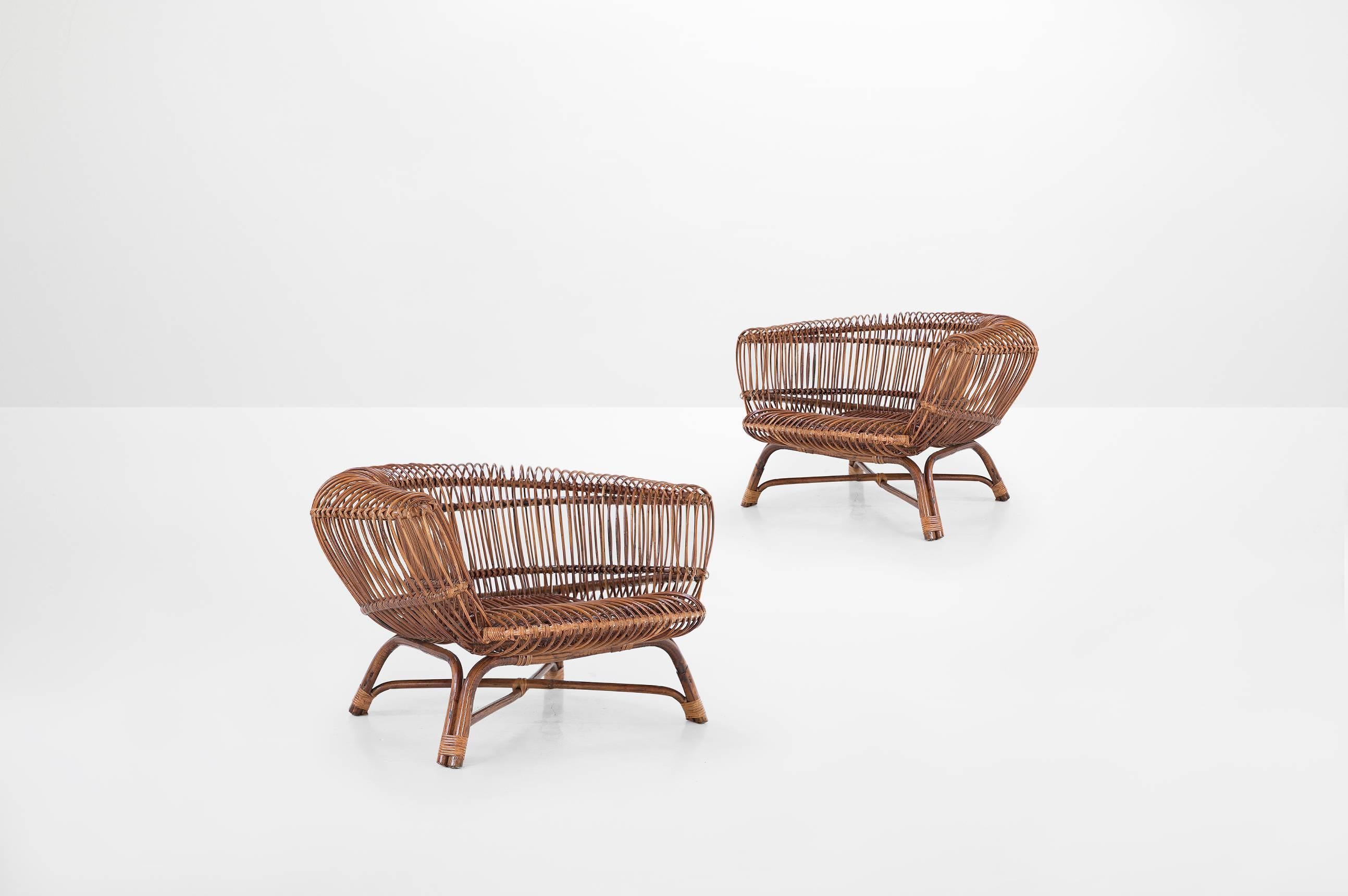 Paolo Tilche (1925-2000)

Pair of armchairs model “Silvia”
Manufactured by Arform, 
Italy, 1956
Rattan
Pair of Italian 20th century ratan armchairs Model “Silvia”

Measurements
100 cm x 100 cm x 63 cm
39.37 in x 39.37 in x 24.8