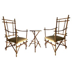 Paire de fauteuils et table basse Paolo Traversi, bambou et laiton, Italie