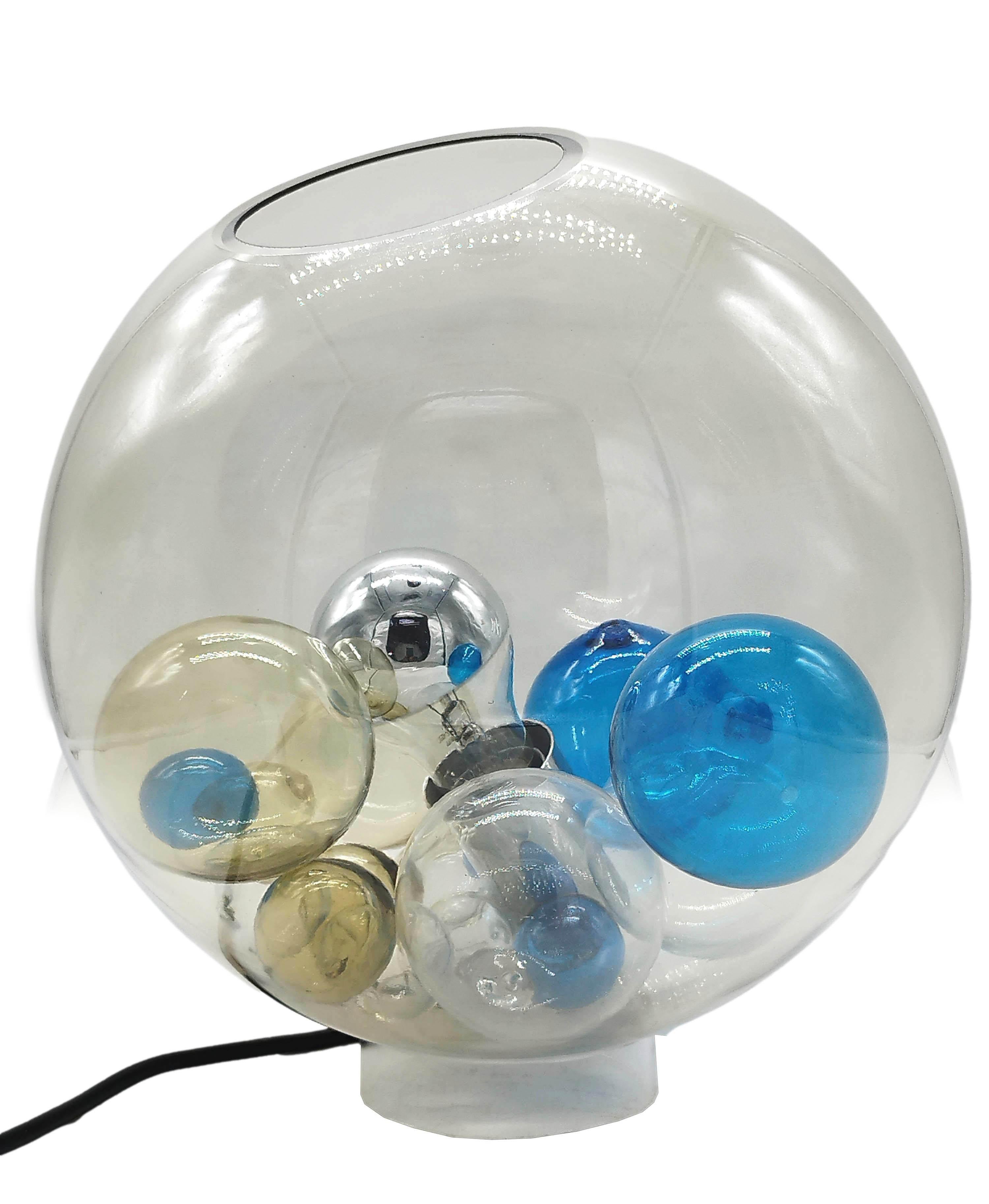 Rare table lamp, Pallotta model. Designed and made by Studio Venini, circa 1970. This design consists of a transparent smoked globe made of glass. Inside the lamp are several polychrome spheres in blue,light blue and white transparent. The Palotta