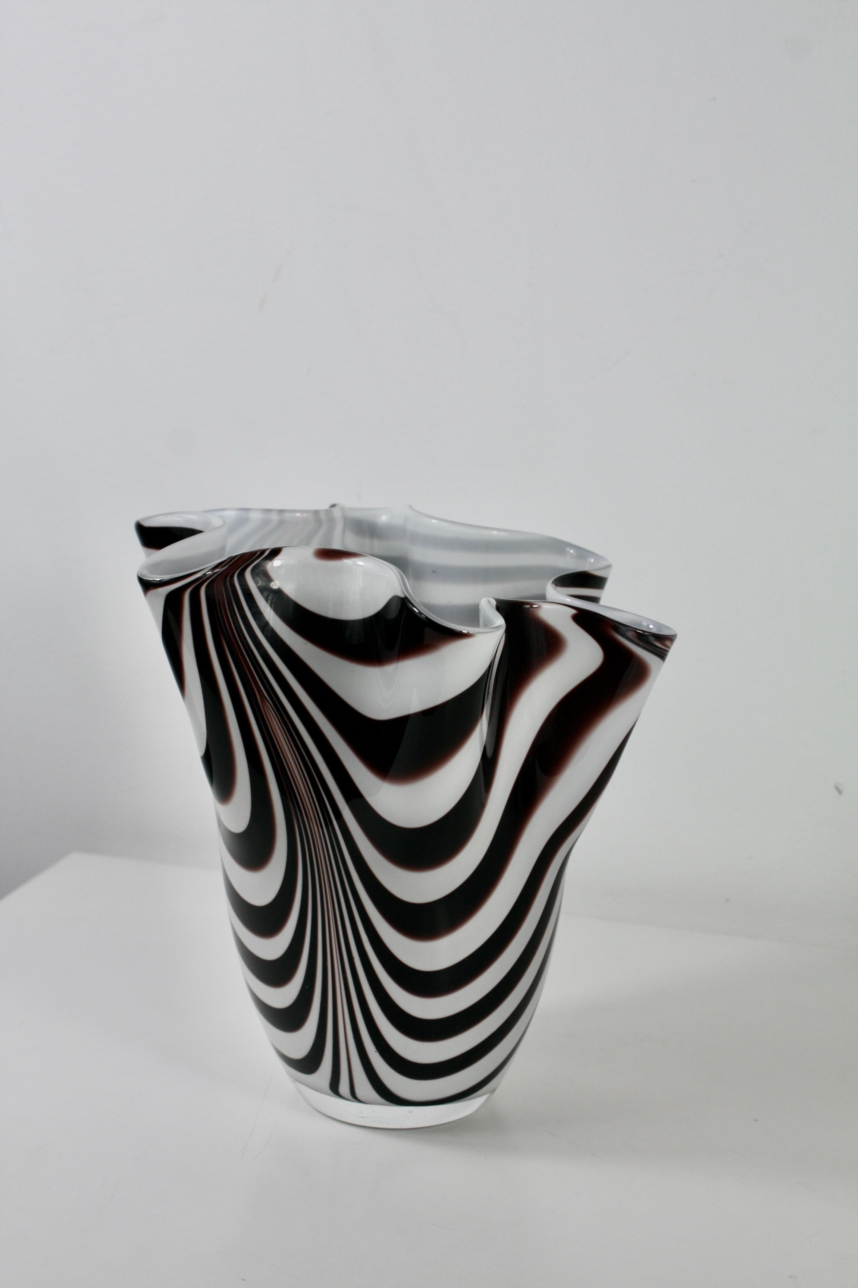 A striking and elegant Fazzoletti (“handkerchief”) vase designed by Paolo Venini and Fulvio Bianconi for Venini, Murano, during the 1950s.

Handblown on the island of Murano, this piece displays the iconic fluid, organic shape that made the
